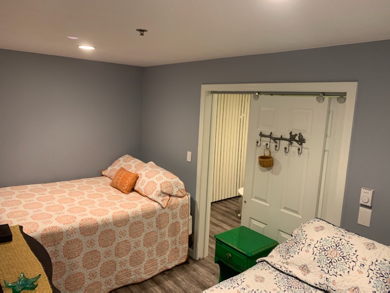 Bedroom area featuring one queen and one full size bed.