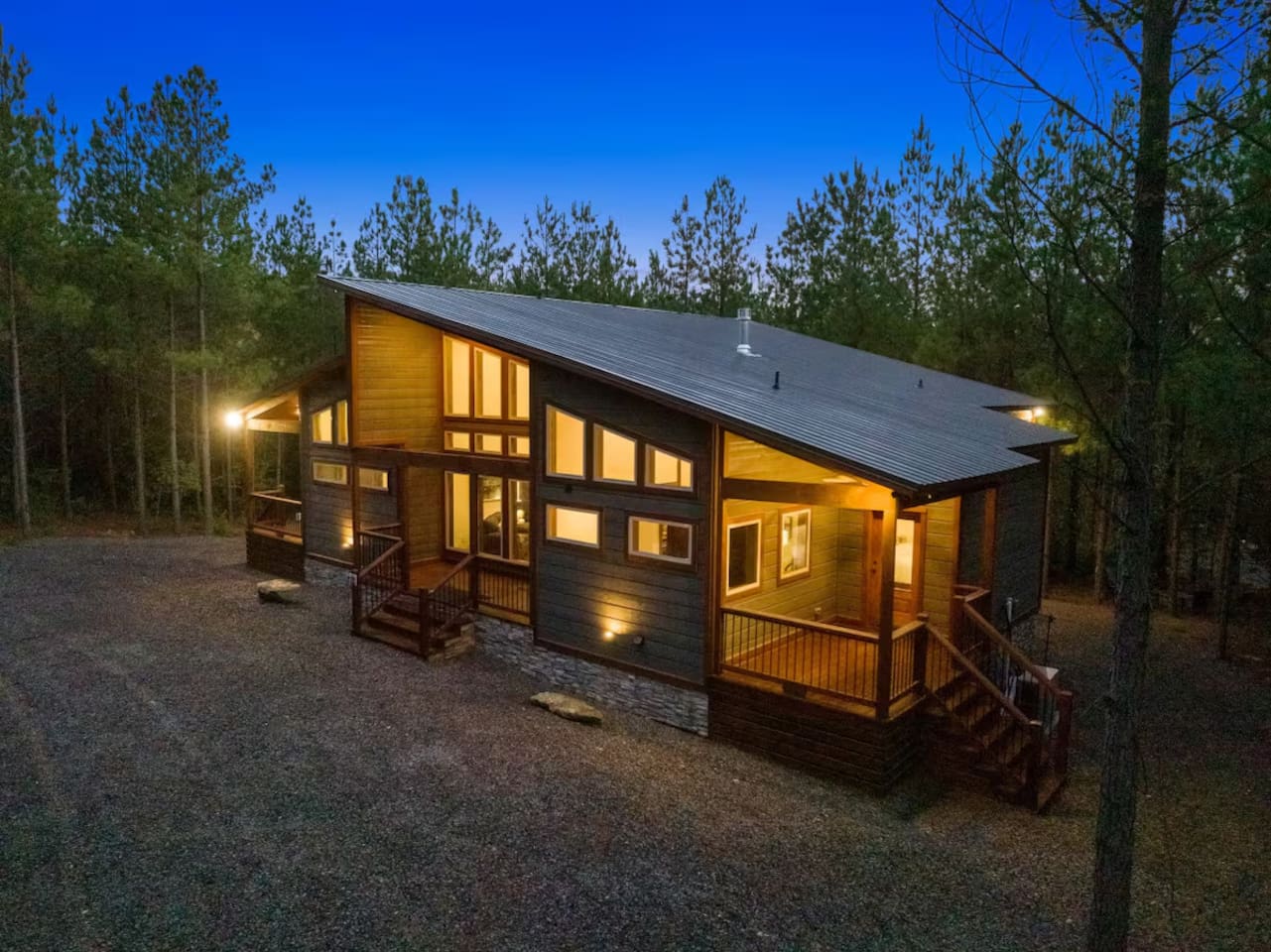 Designed for both comfort and curb appeal, this cabin’s beautiful façade, expansive porches, and natural wood details set the tone for your ultimate forest getaway.