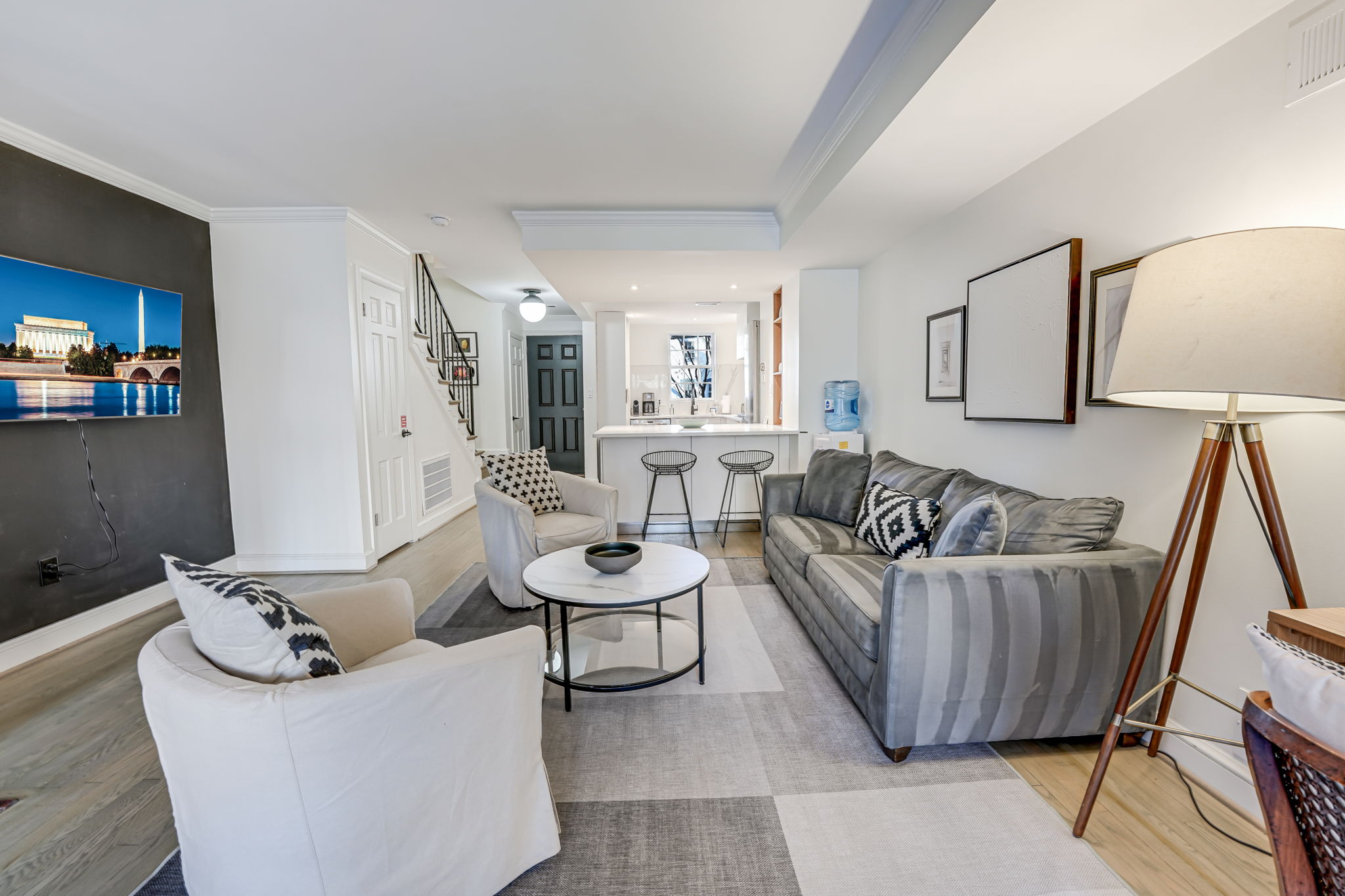 Living Room: Open Concept Kitchen, Front Entrance, Sleeper Sofa, 55" Samsung TV.