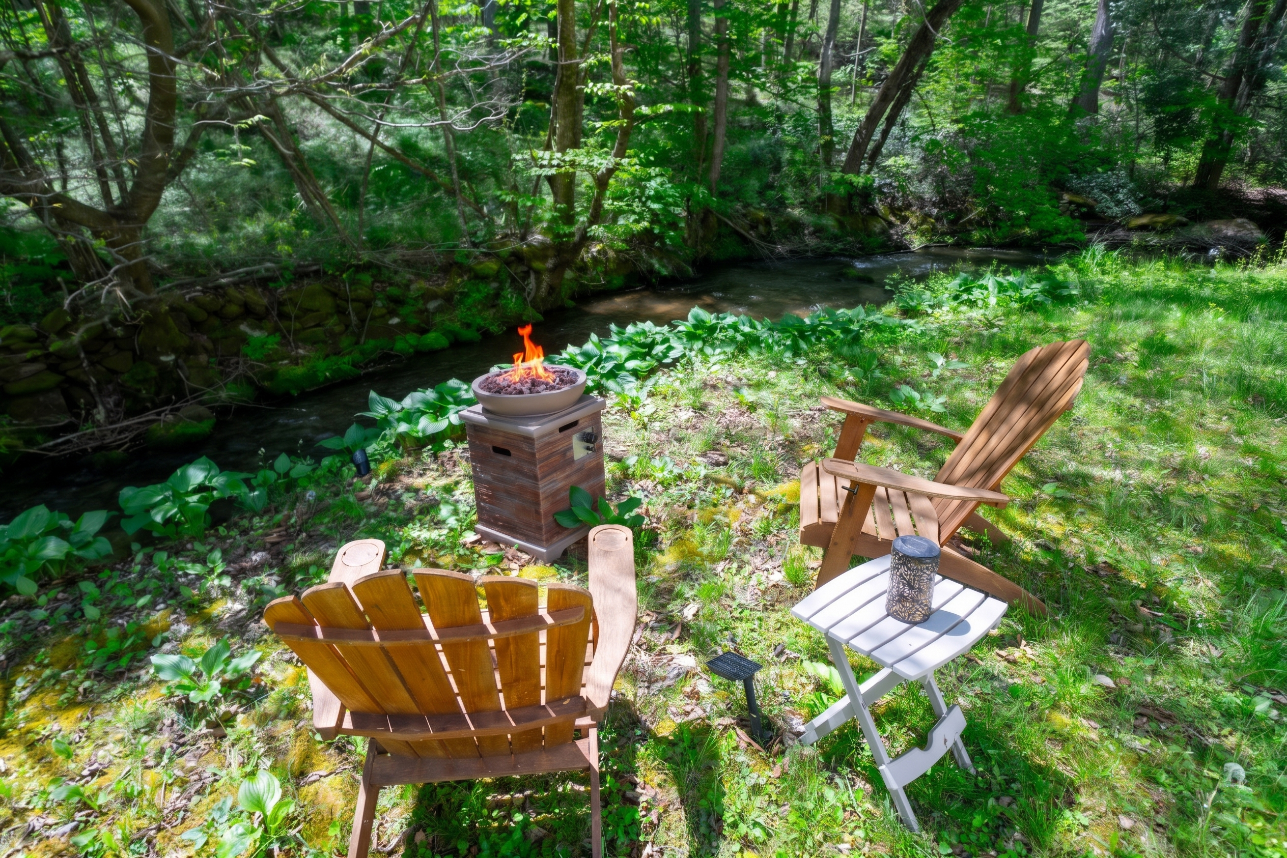 Relax by the propane fire pit while enjoying the sights and sounds of Yellow Creek.