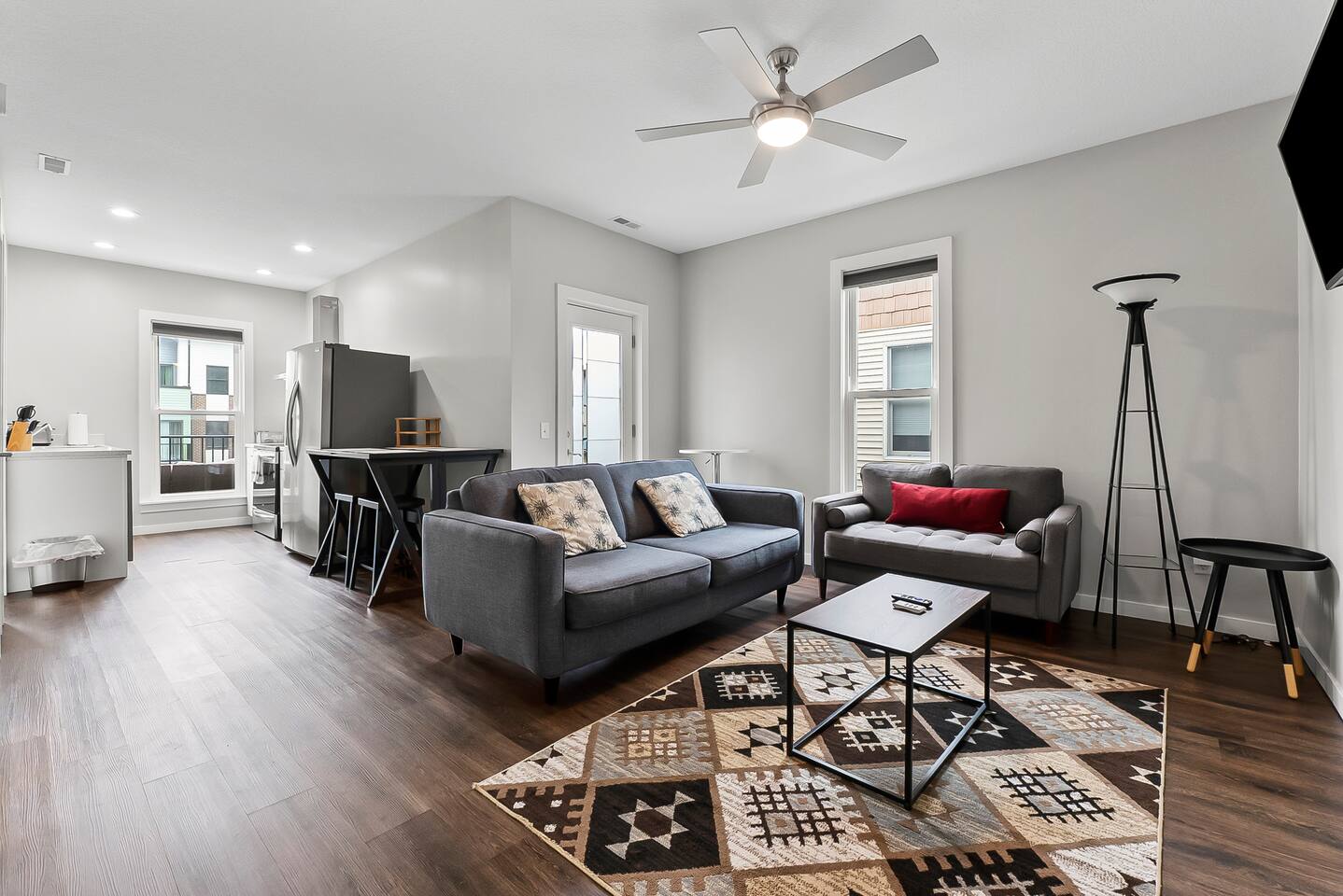 Open-concept design flows seamlessly from the living room into the kitchen and dining area.