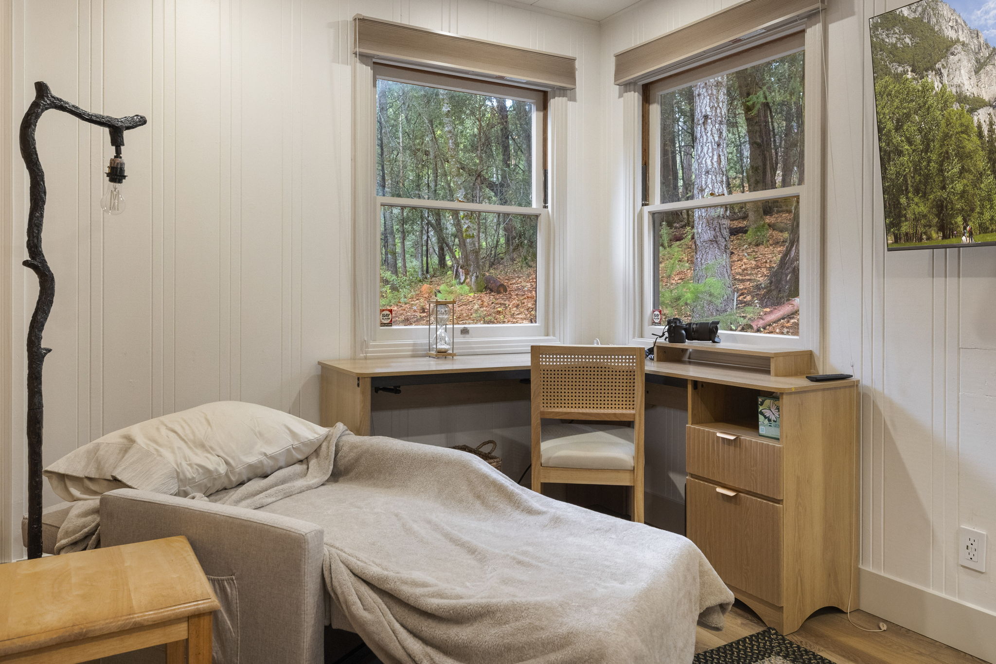 Childs sleeping area on pull out chair in master bedroom.
