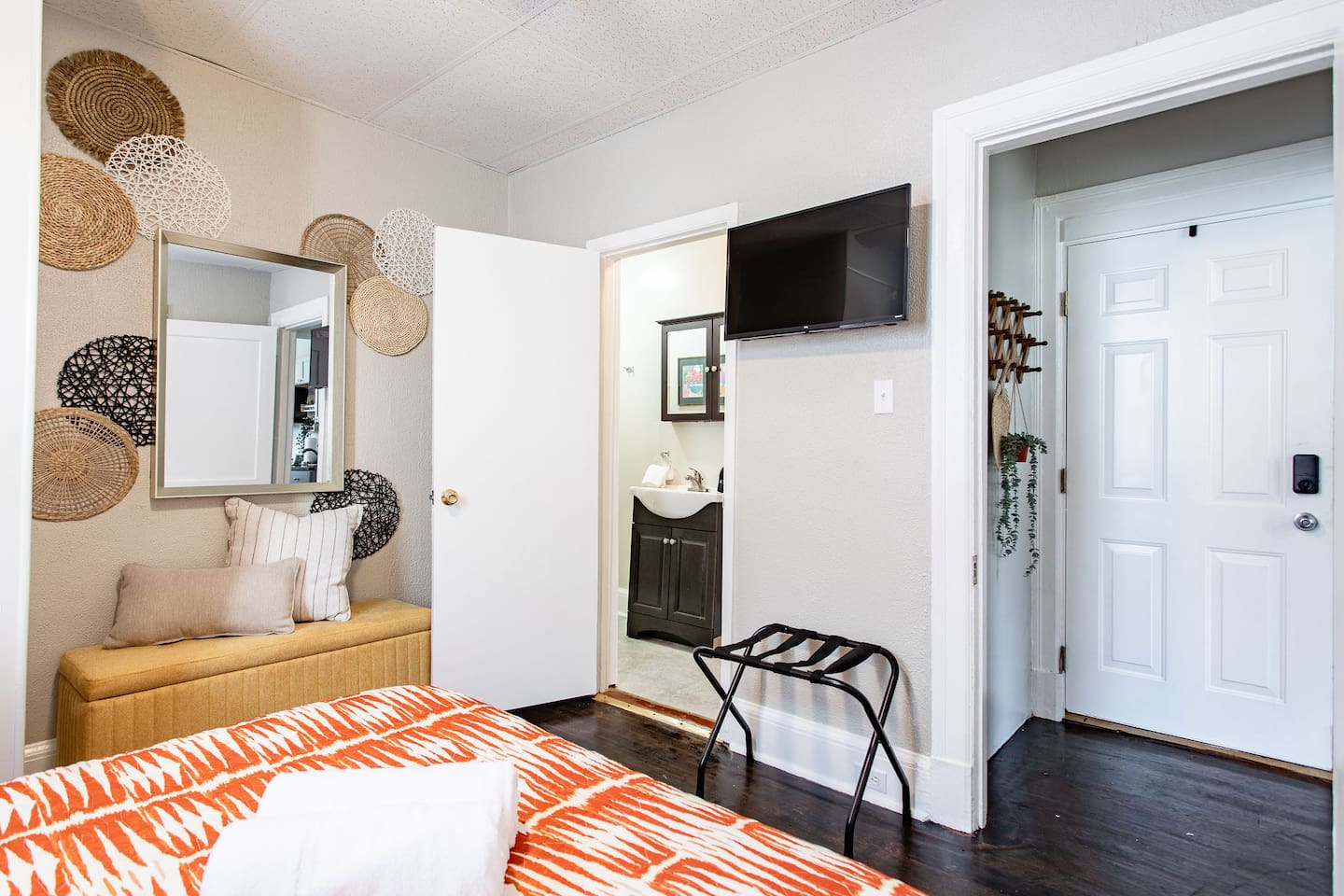 Relaxing bedroom with a TV, offering the perfect spot to unwind and enjoy your favorite shows or movies from the comfort of your bed.