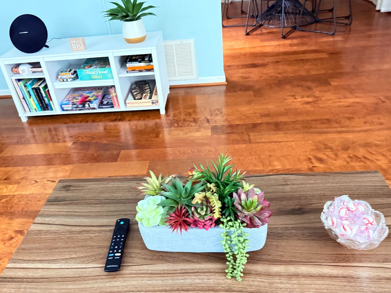 Coffee table centerpiece adds a natural, calming touch to the living room’s cozy design. 