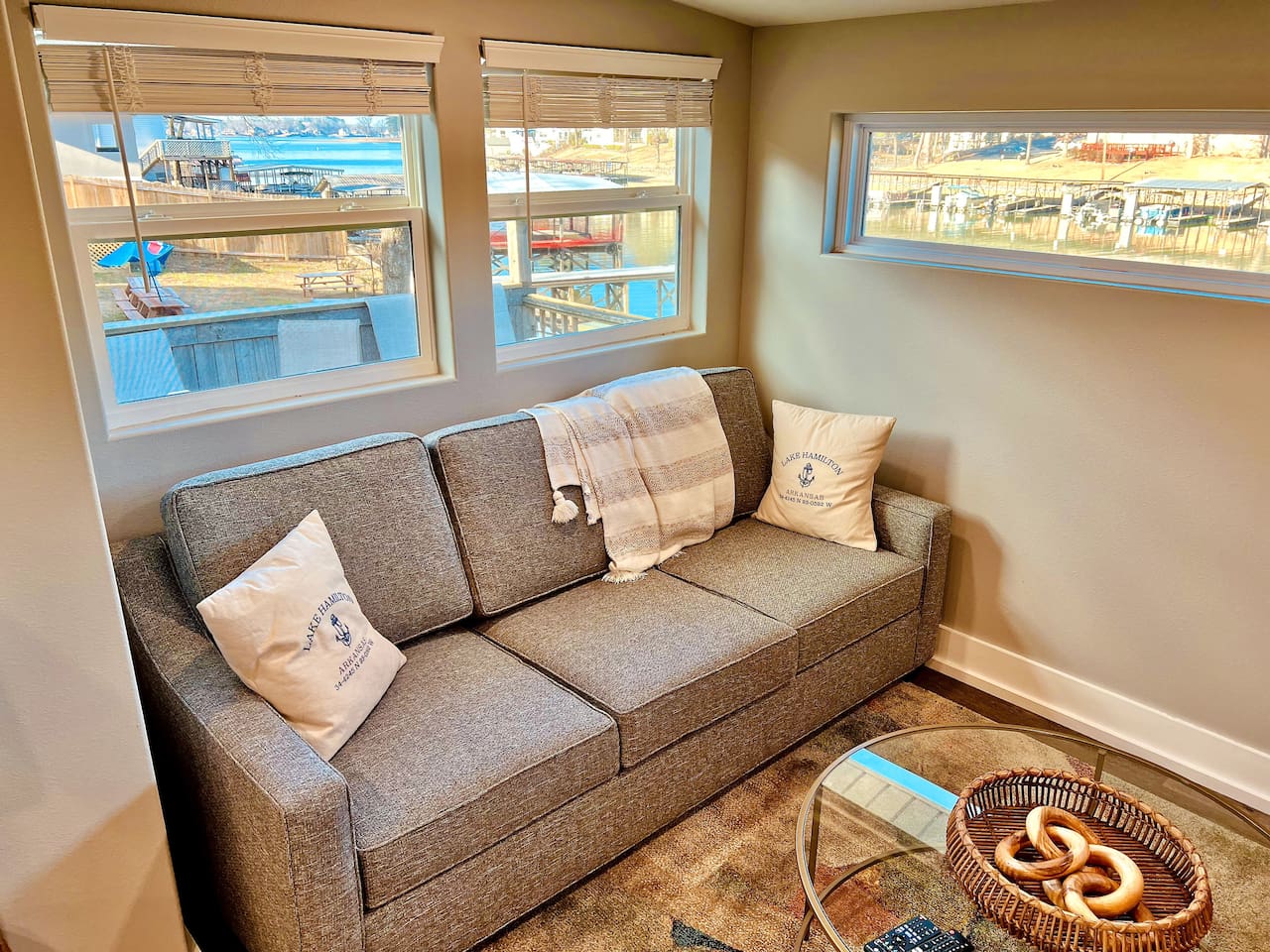Living Room: Bright and inviting with stunning lake views and stylish decor for relaxing moments!