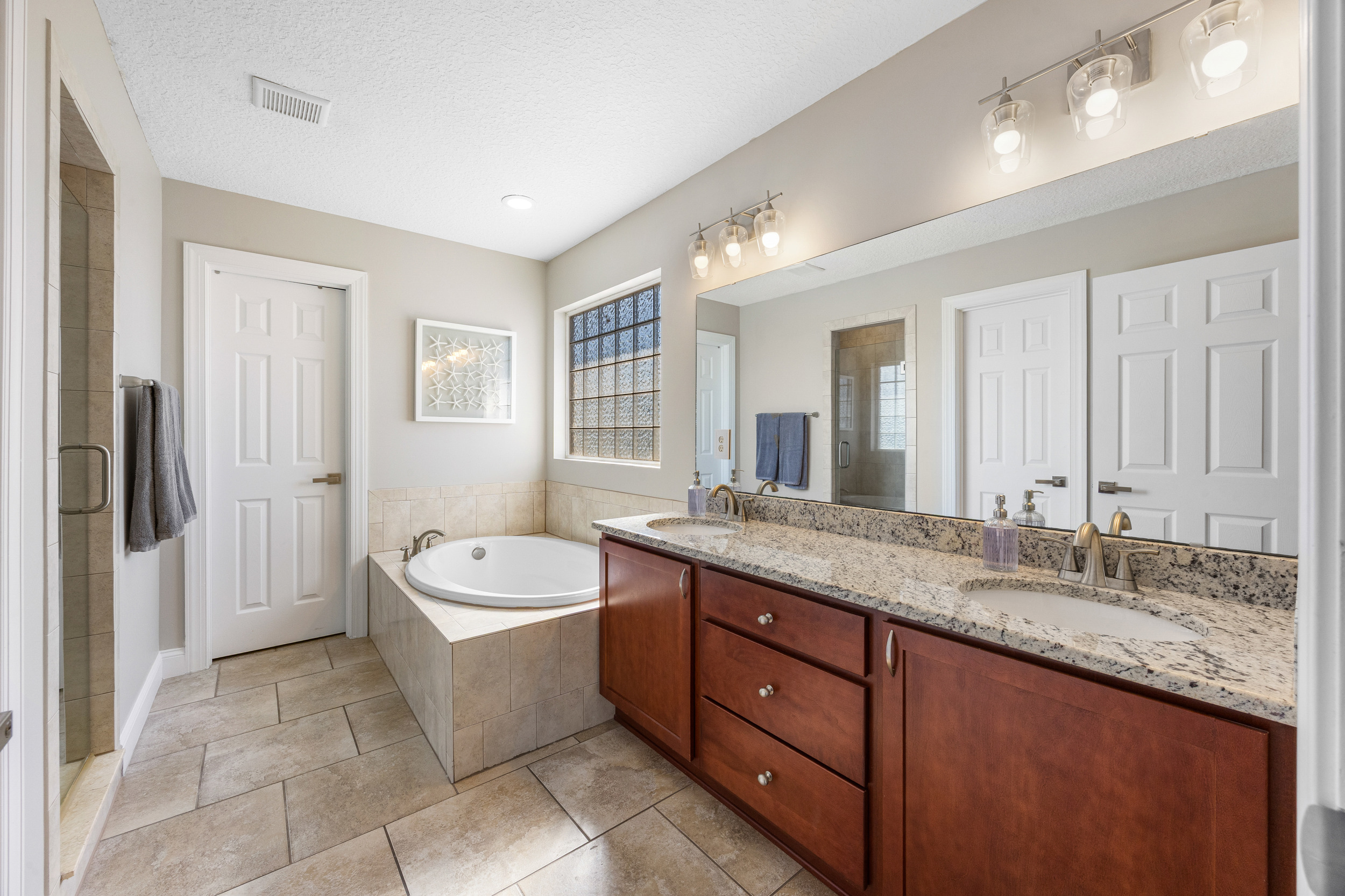 Dual-sink vanity and bright master bathroom