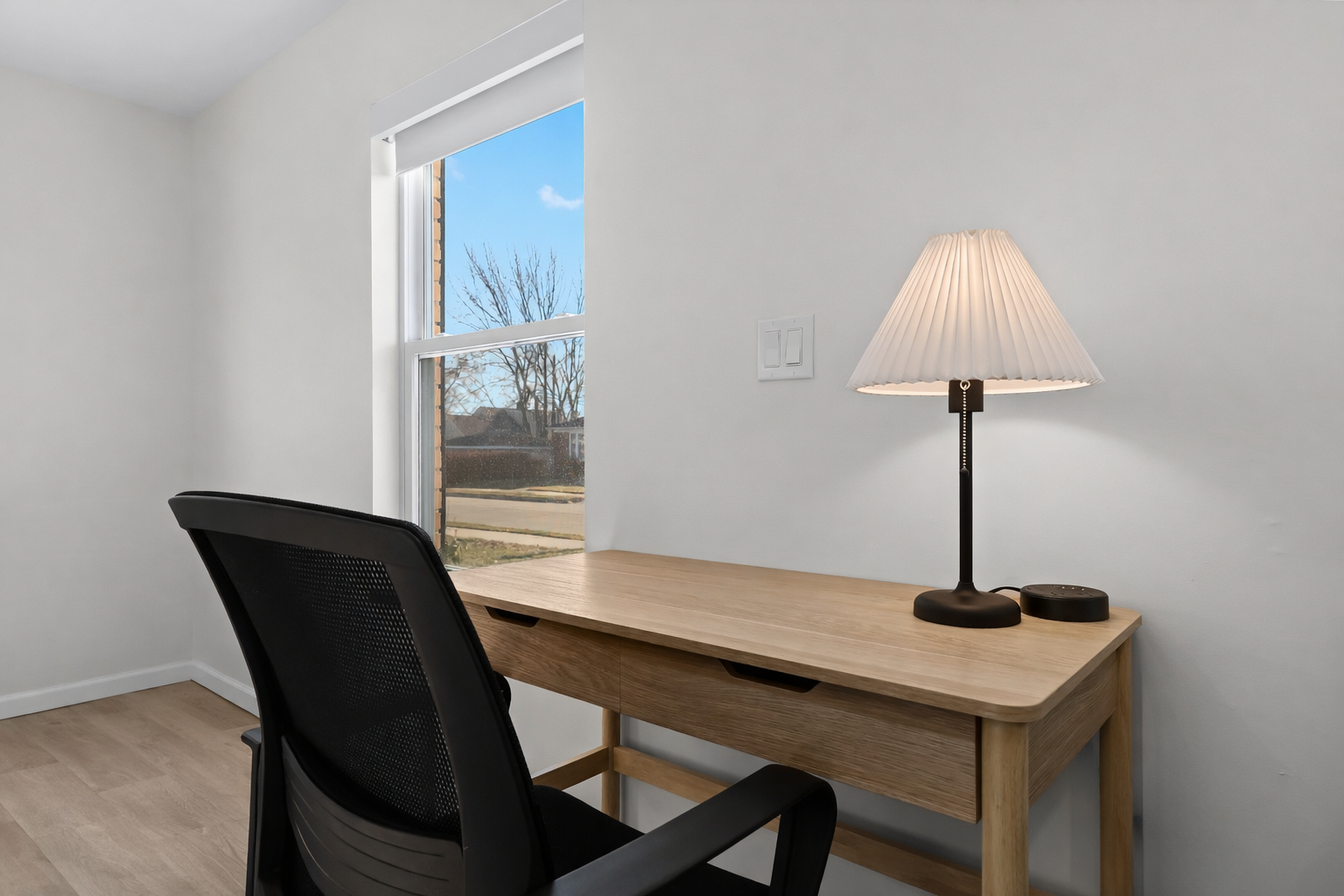 Bright, dedicated workspace with a comfortable desk, task lighting, and natural light—perfect for working remotely or staying productive during your stay.
