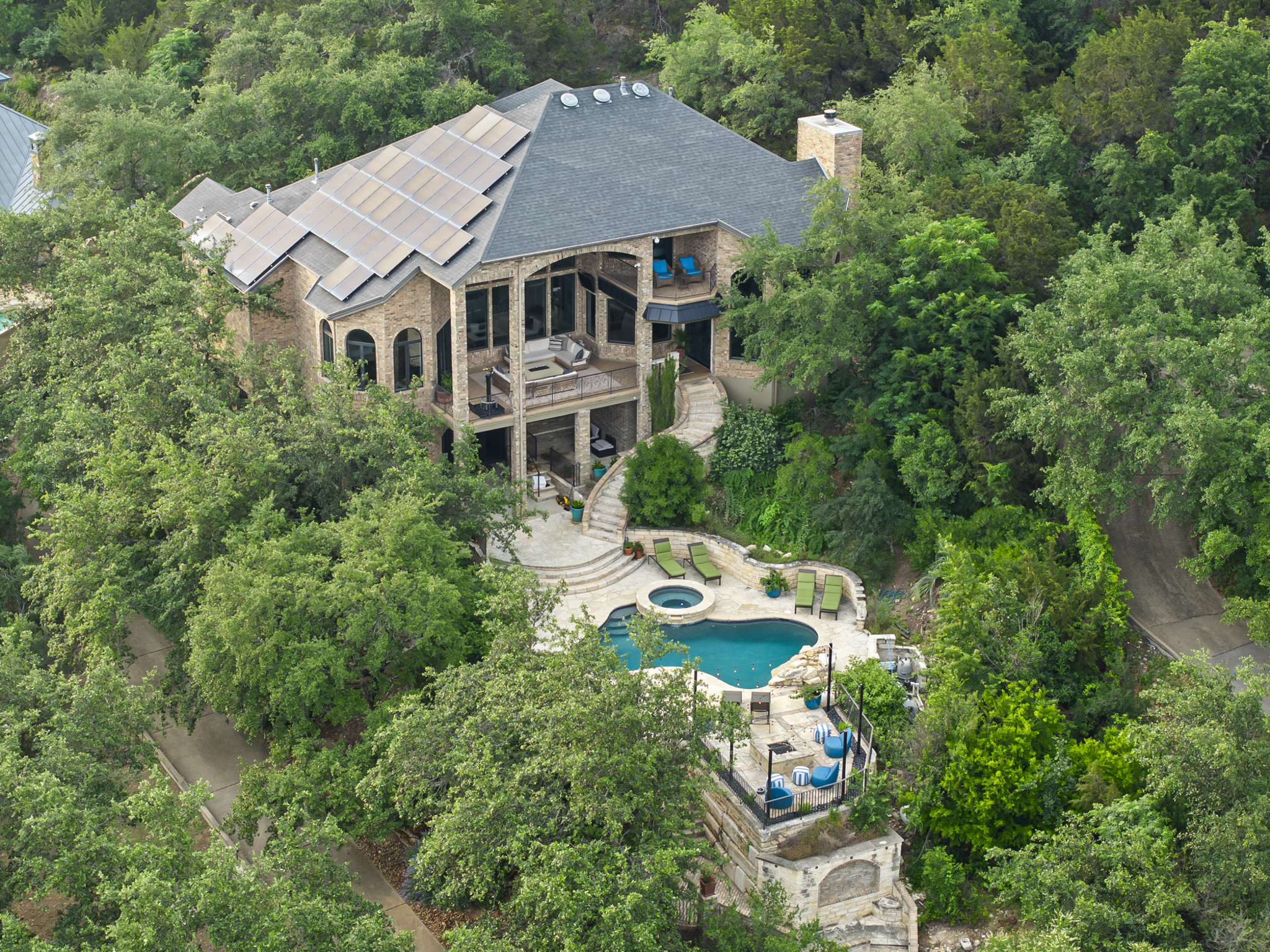 House is situated on a 1+ acre lot surrounded by trees.