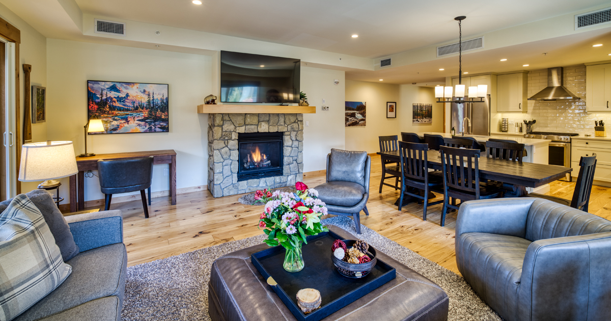 Looking from the living room towards the dining table and kitchen. Dining table extends to seat 8-10