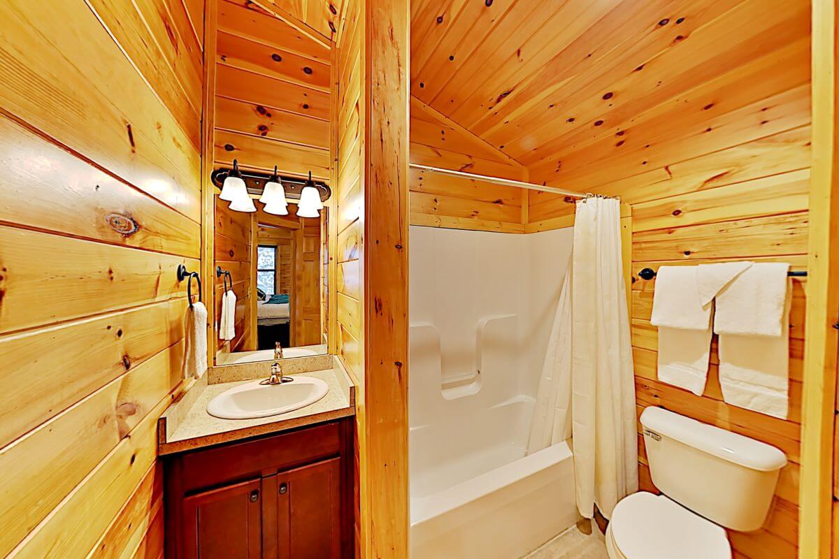 The vanity area is a small space with little elbow room but provides enough space for one person at a time.