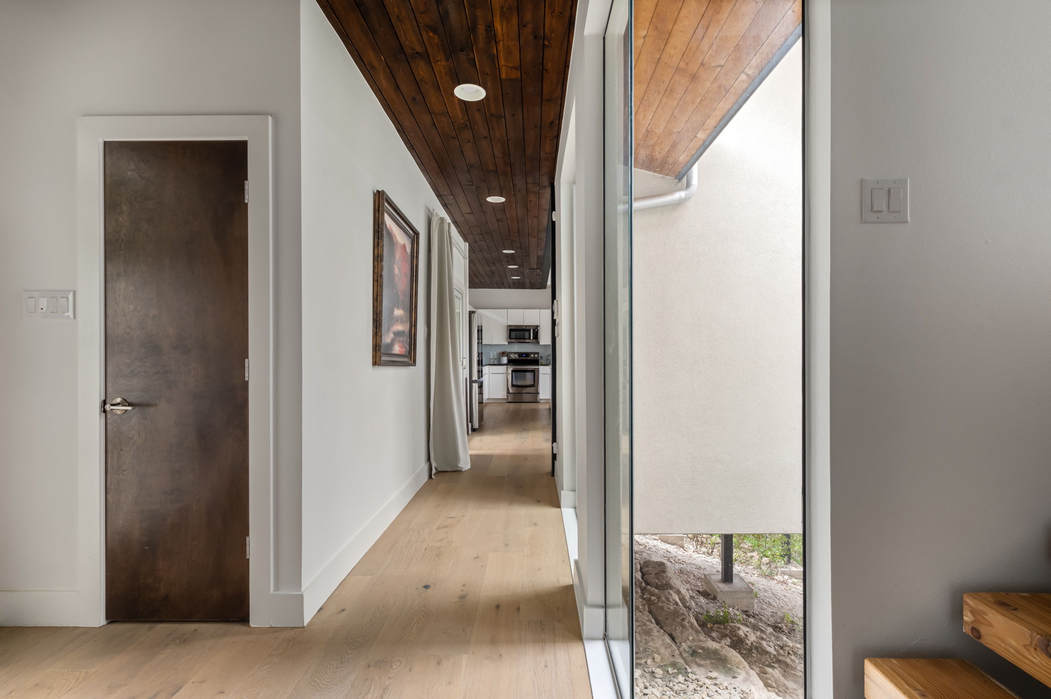 Light-filled hallway with modern finishes