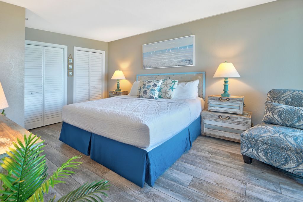Rest up after a day in the sun in this plush, coastal-themed master suite.