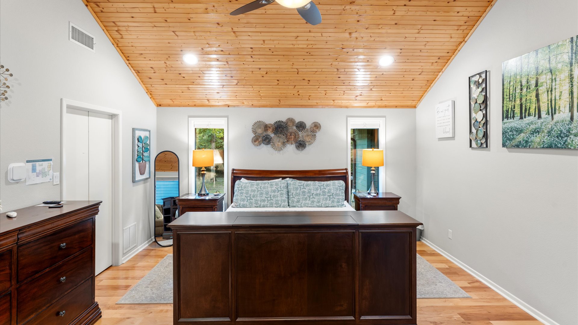 King 1 Bedroom offers a split king adjustable bed with a 40" TV in the footboard, charger lamps, extra outlets, a large dresser, 2 luggage racks, hangers, adult robes, and a reclining loveseat