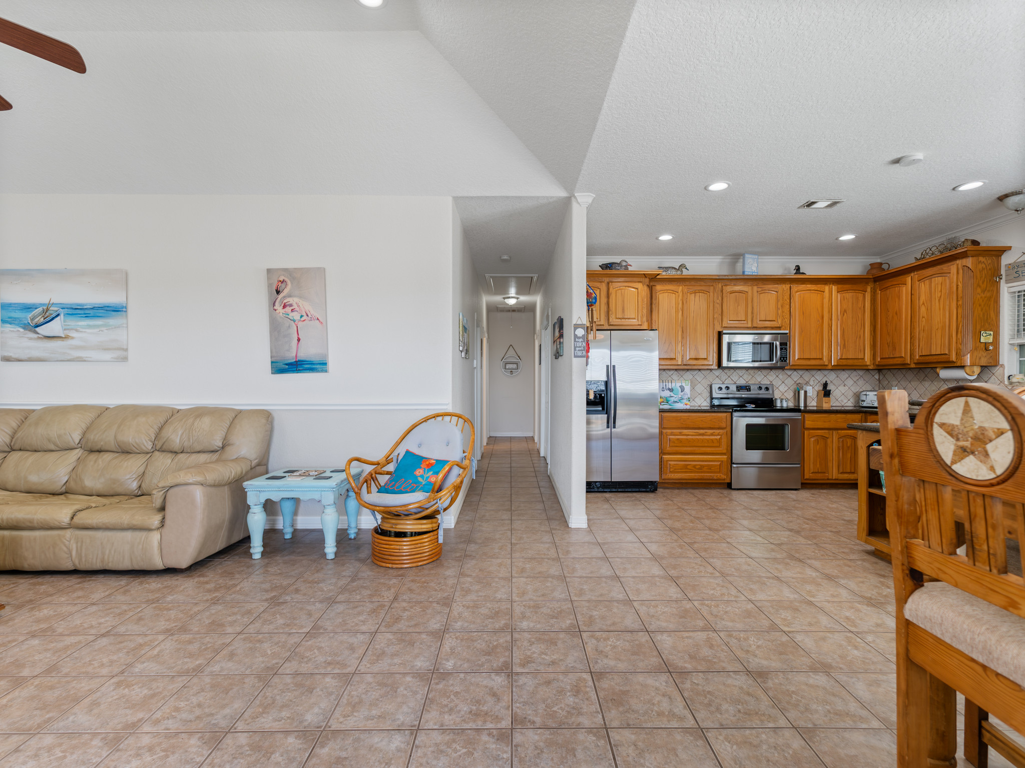 Living room/Kitchen with view of hallway leading to bedrooms