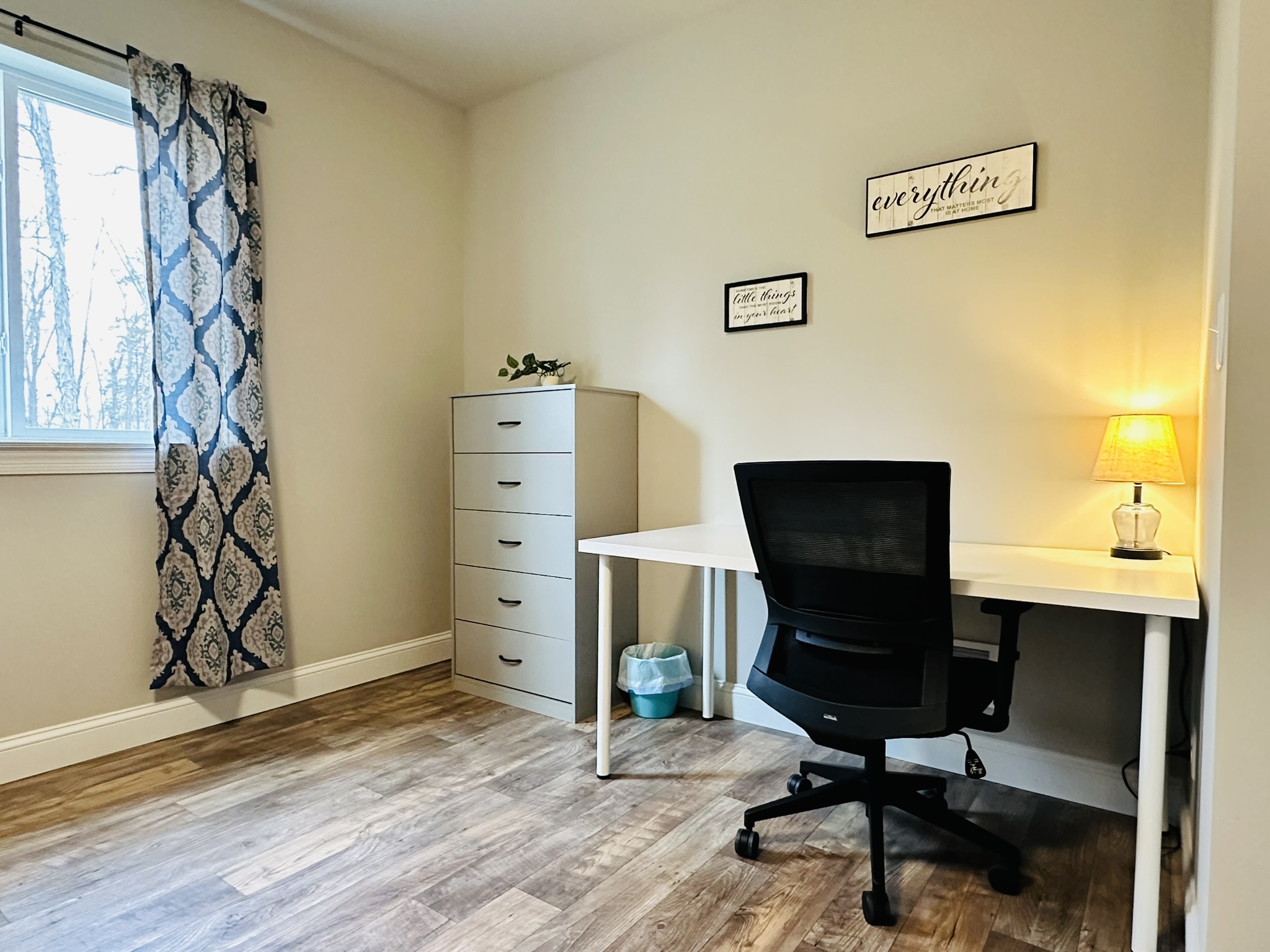Workspace with large desk, office chair, and lamp. Gigabit Fiber Optic Internet with 5Ghz Wireless N.