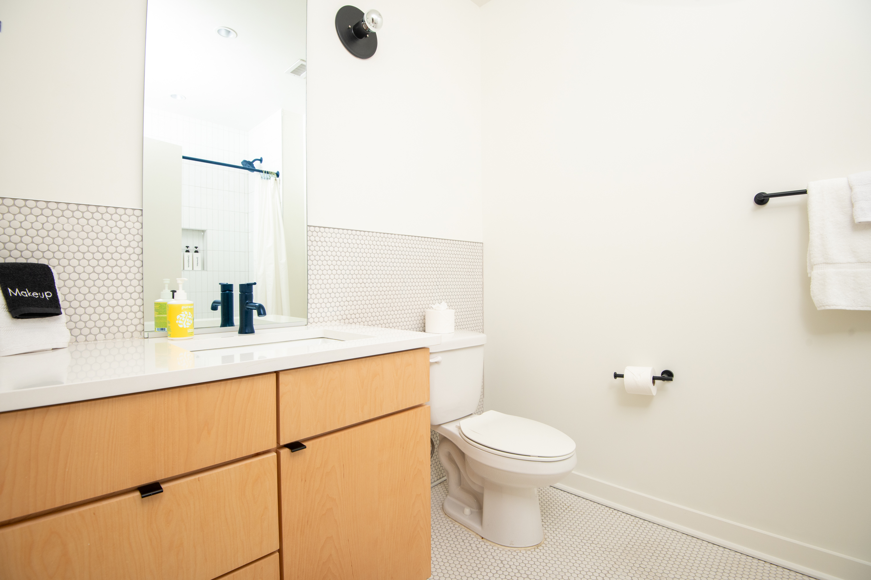 Fresh, modern bathroom with vanity and essentials