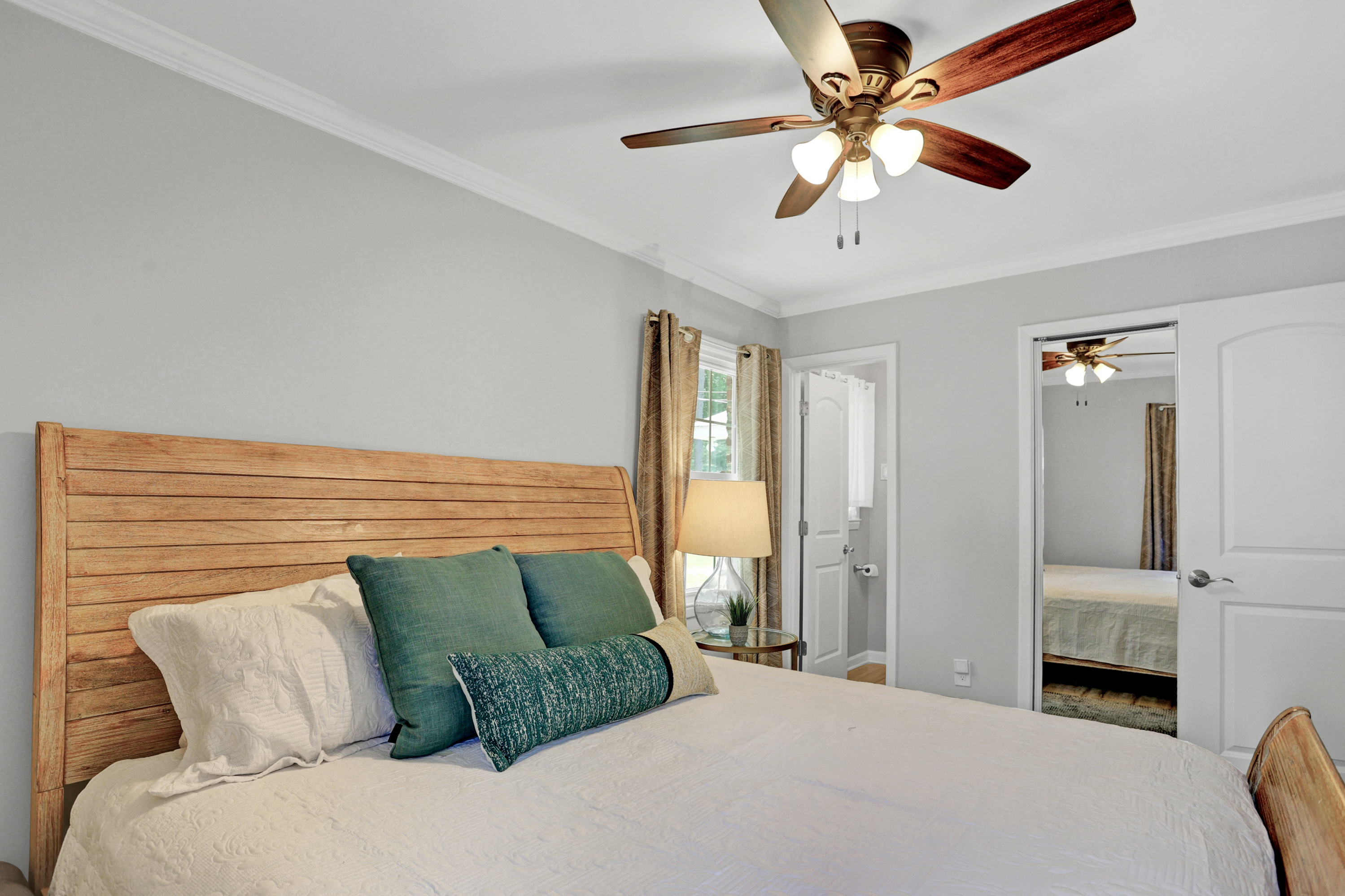 Sink into comfort—this king bed is topped with soft linens and extra pillows for the perfect night’s sleep.