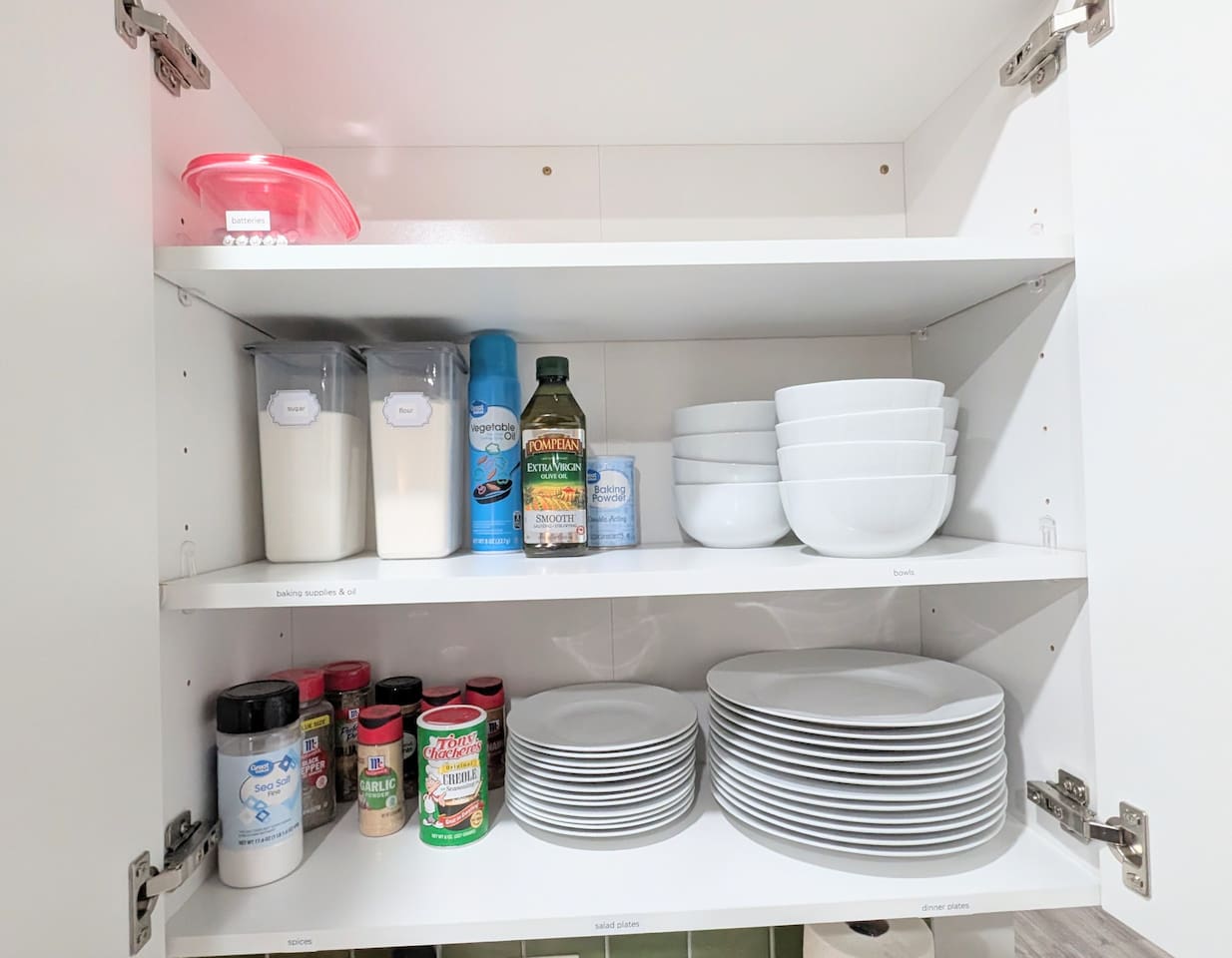 Plenty of dinner ware, spices, and baking supplies. 