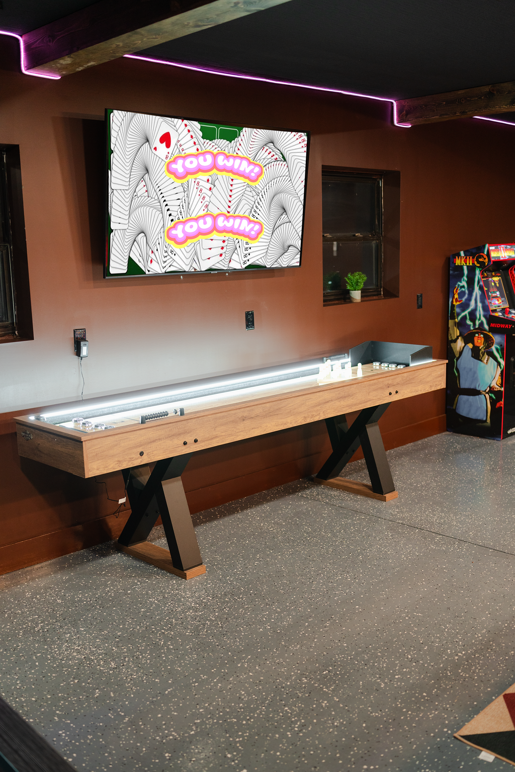 The shuffleboard table gives the game room another fun spot for a little friendly competition.