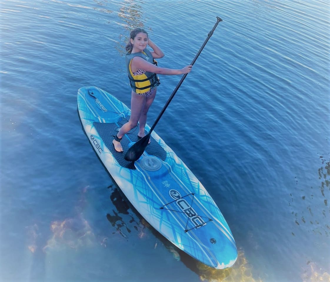 Guests enjoying our paddle boards and exploring the "Bahama Canal", Our "Back Yard"