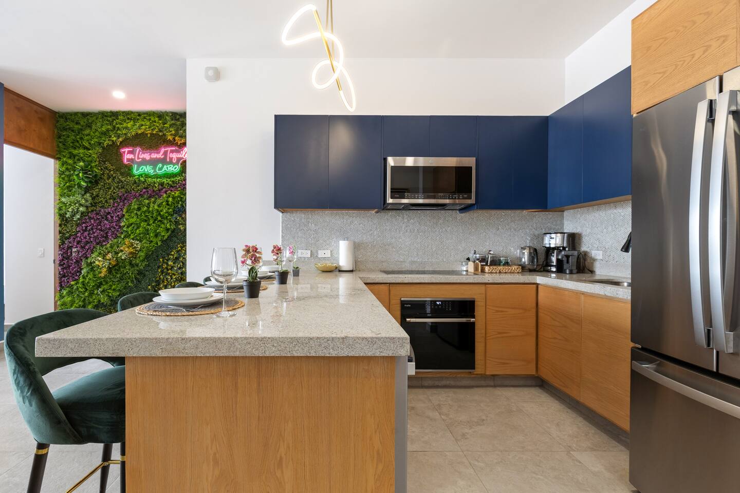 Dive into this chic Cabo kitchen with granite countertops, GE Profile Series Appliances—perfect for culinary delights.
