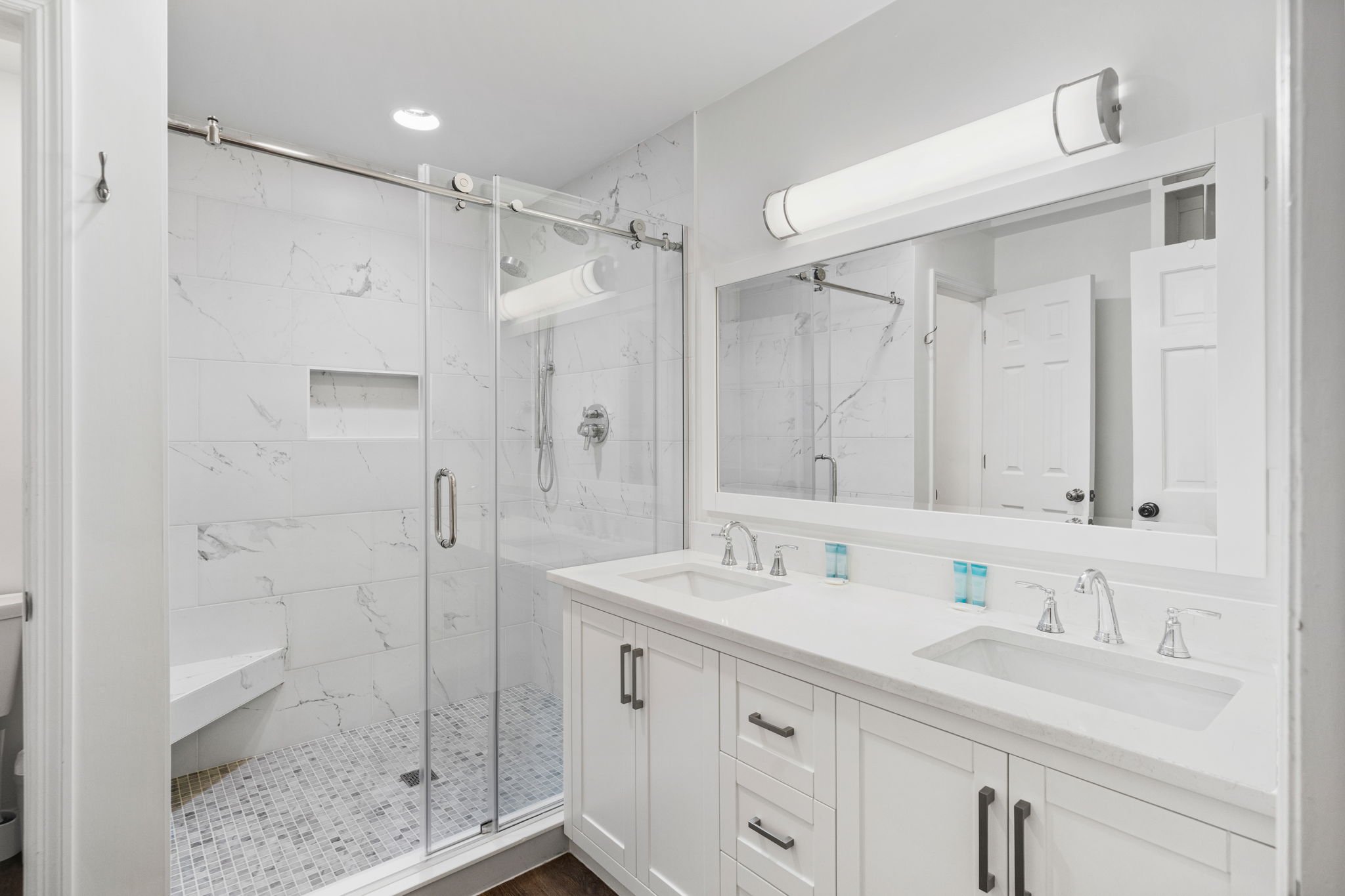 Primary Ensuite Bathroom 1 With Dual Vanities And Walk-In Marble Shower |  IOP Escapes Beach Blessing | 3705 Hartnett Blvd, Isle of Palms, SC