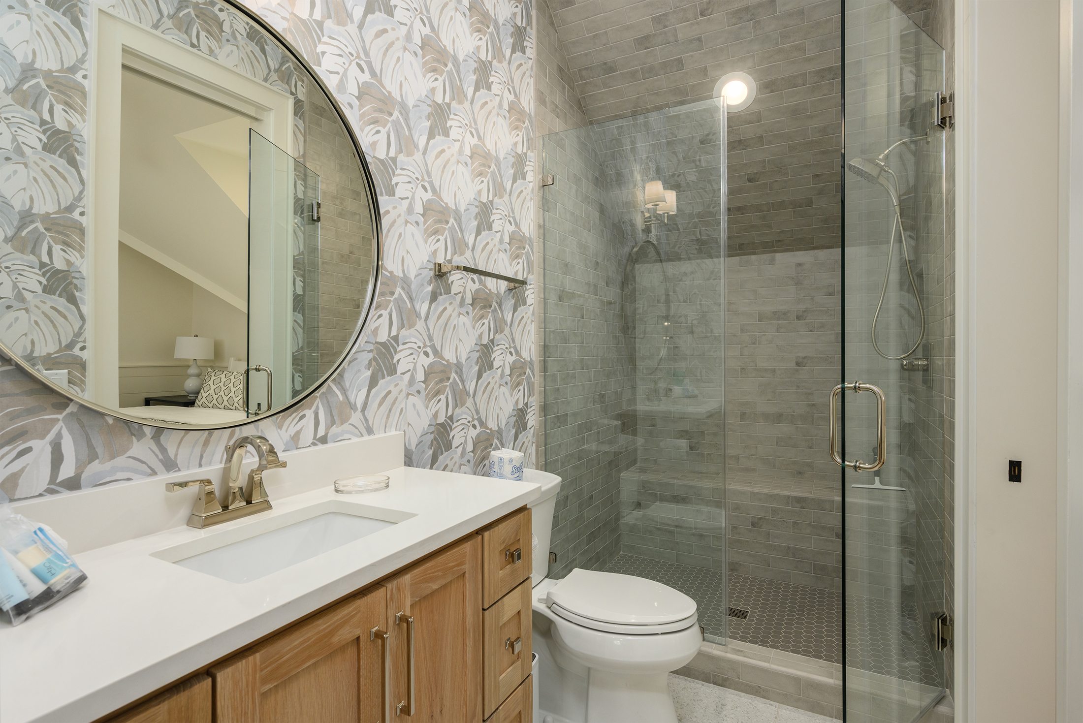 Upstairs center bedroom bathroom feaures shower and single vanity