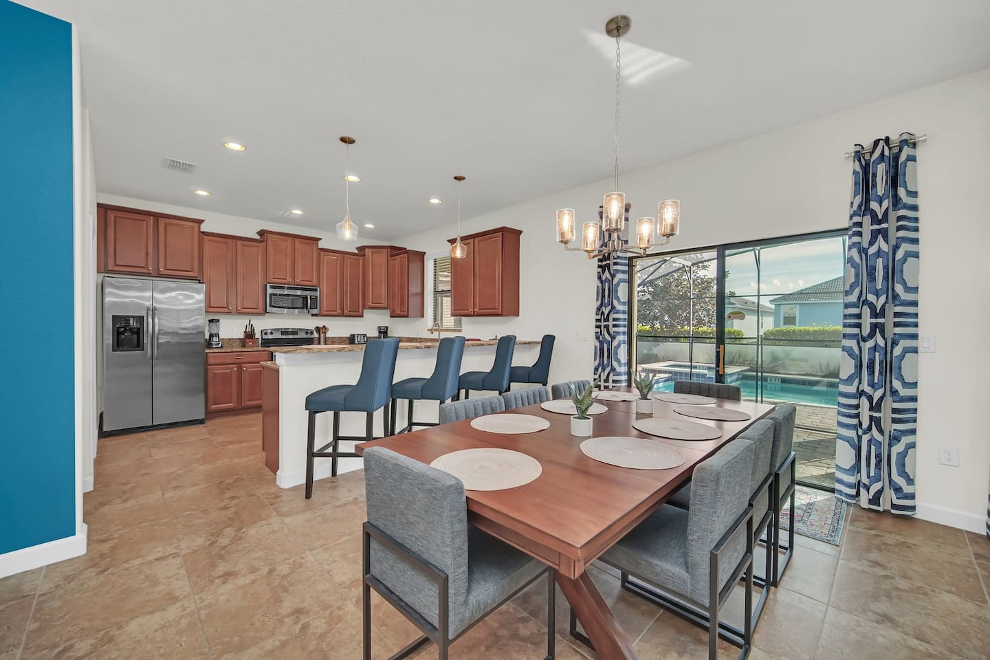 Large Kitchen with large fridge. Bar stools for extra seating and Dining Area that  can fit a party of 8. Great place to gather, hang out and eat