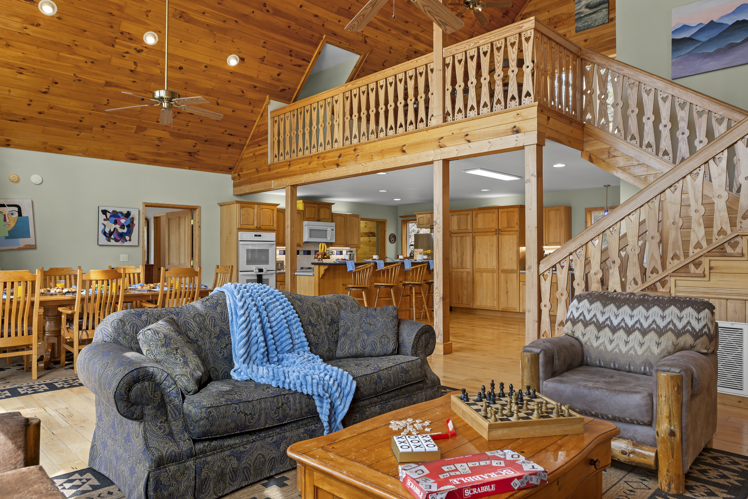 Living Area: Enjoy open spaces, vibrant decor, and games in this inviting gathering area!