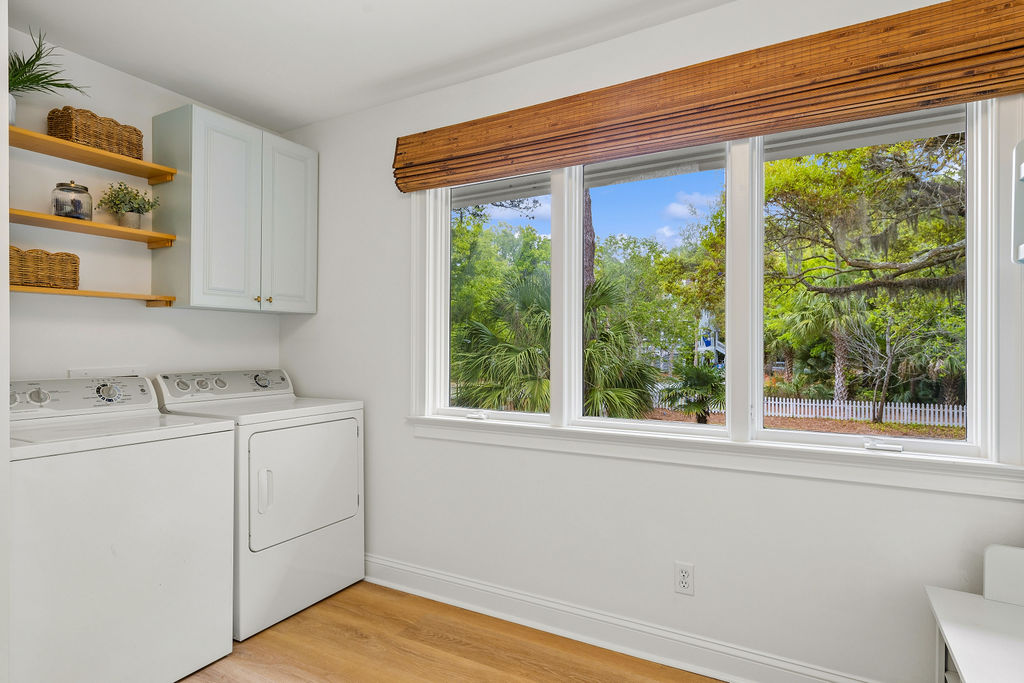 Mudroom with washer/dryer and storage space conveniently located next to the front entry