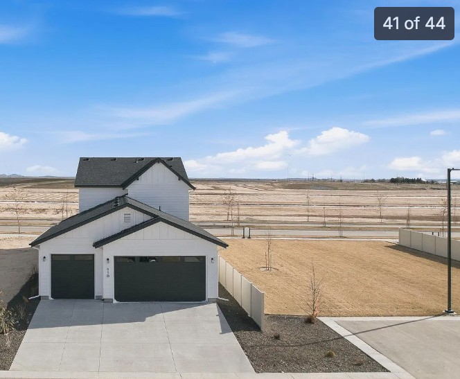 This property offers ample parking, including access to a three-car garage and additional parking spaces along the side of the back of the property.