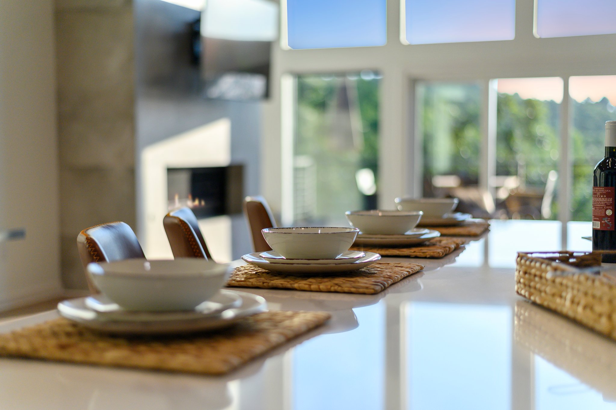 Enjoy dinner with a view in this formal dining space - equipped with premium dinnerware, glassware, and utensils. 