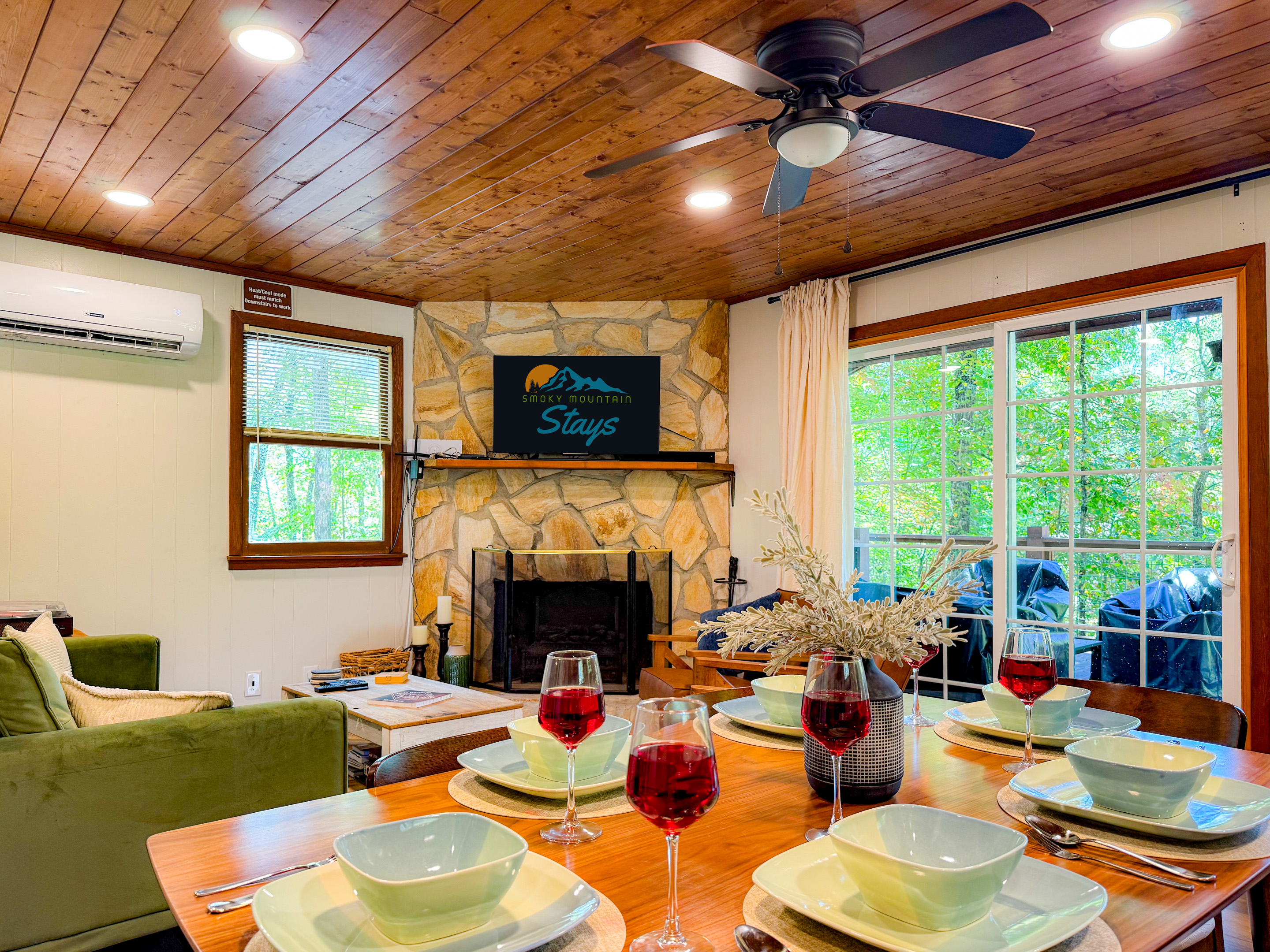 Our main level living room and dining area! Enjoy the peacefulness and treehouse feel from the inside!