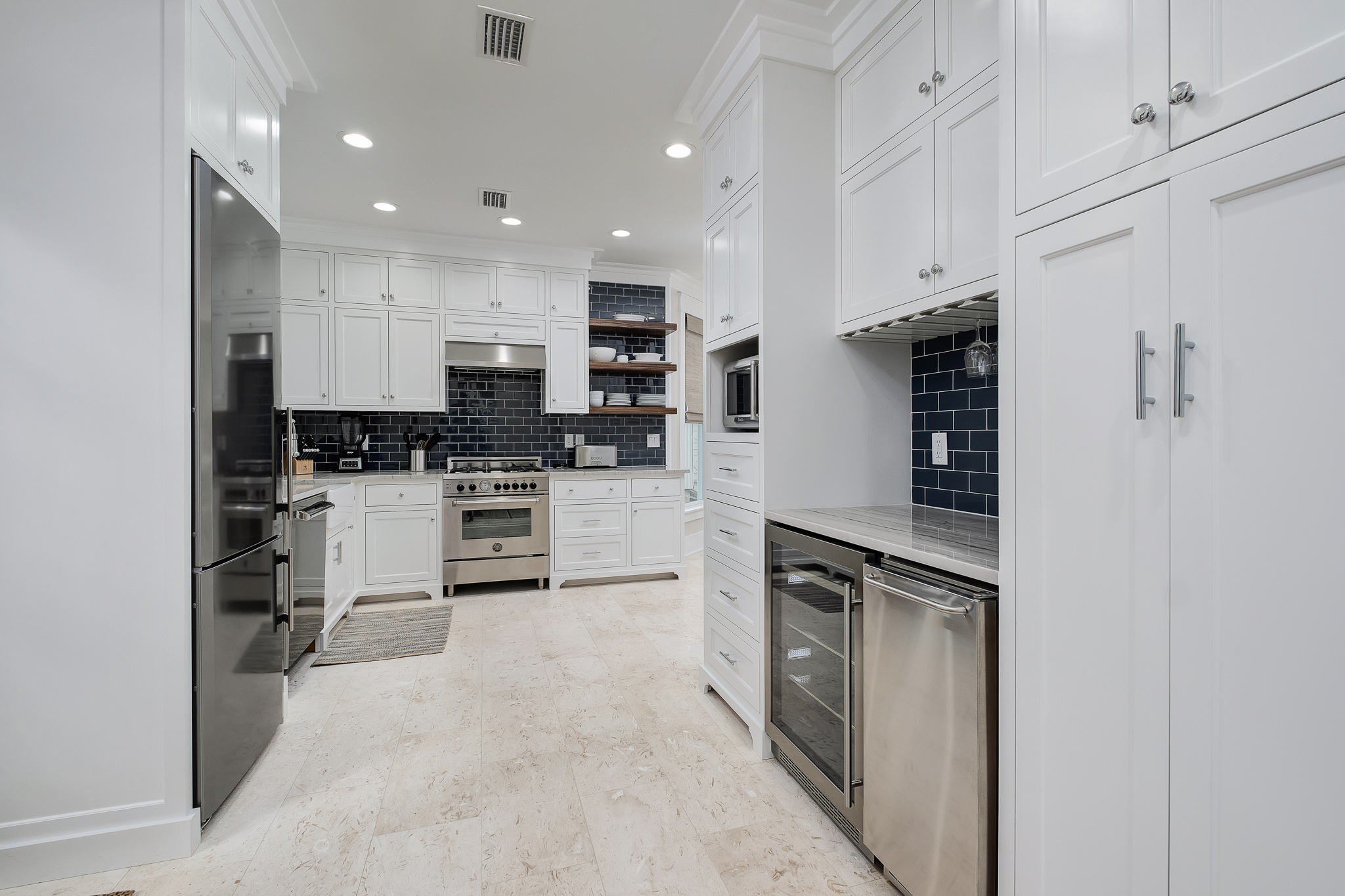 Wine bar with beverage fridge and ice maker.