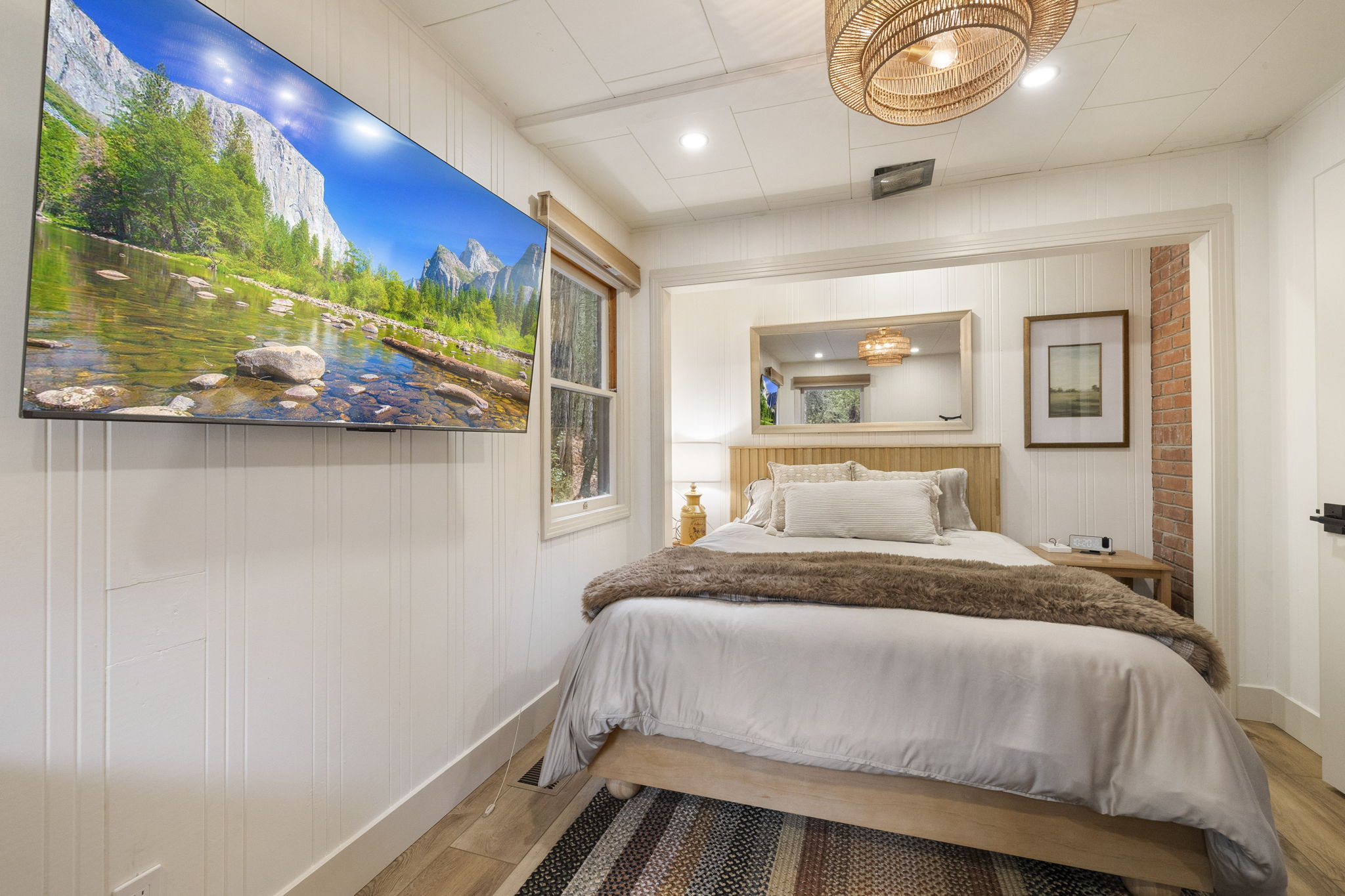 Serene master bedroom with a new memory foam queen mattress. It also includes a separate work/relax area within the room. A smart TV with a HDMI cable and hookups is included as well.