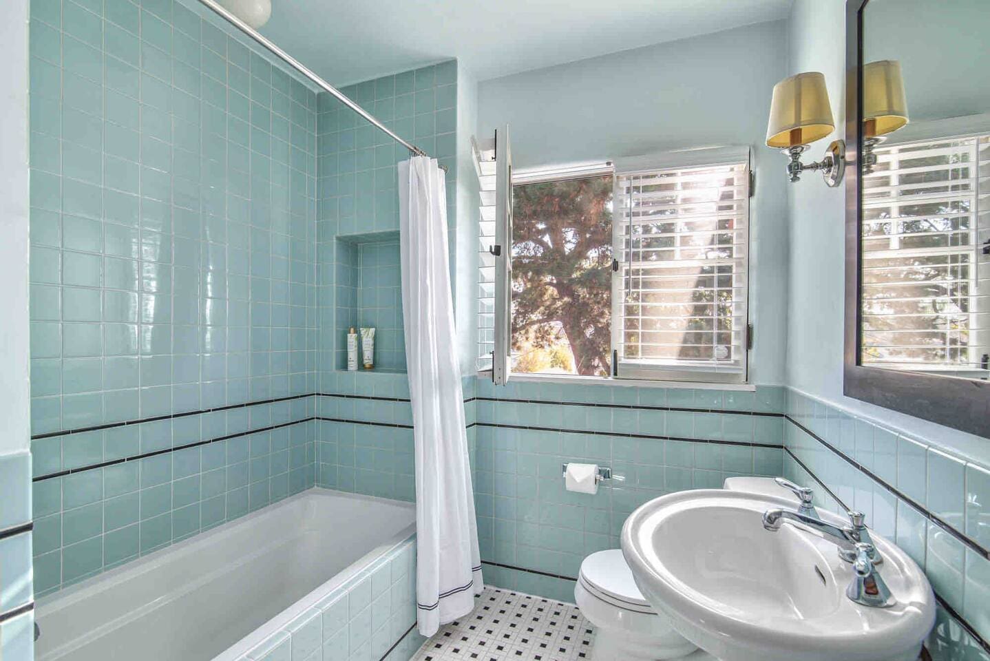 Tub/shower full bathroom down a short hall adjacent to the primary bedroom. 