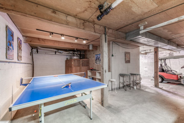 Head to the game room in the garage on the first level, where you’ll find a ping pong table and plenty of other games for endless fun and relaxation!