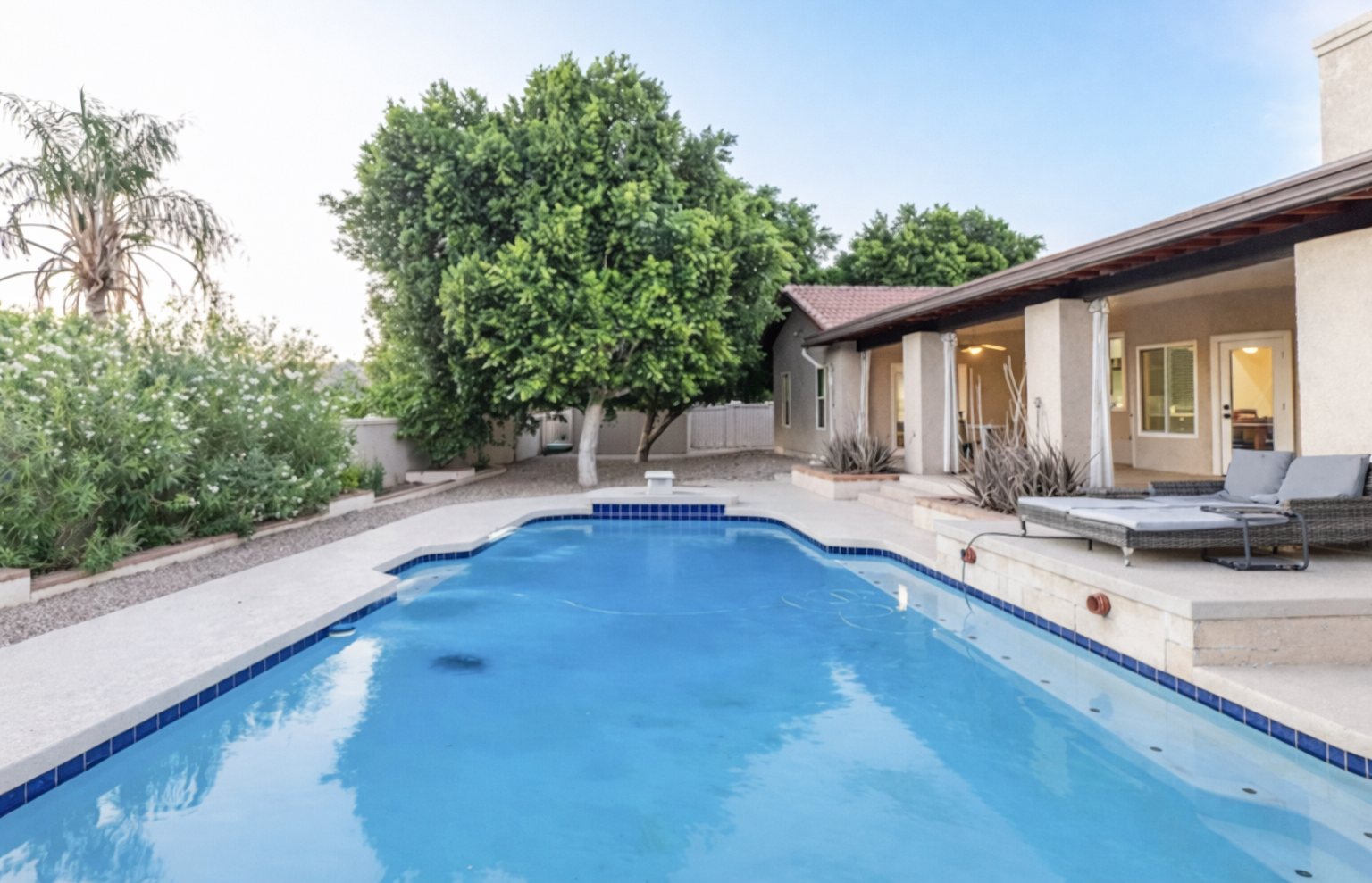 Take a soothing dip in the heated pool surrounded by lush greenery and serene outdoor lounge areas.