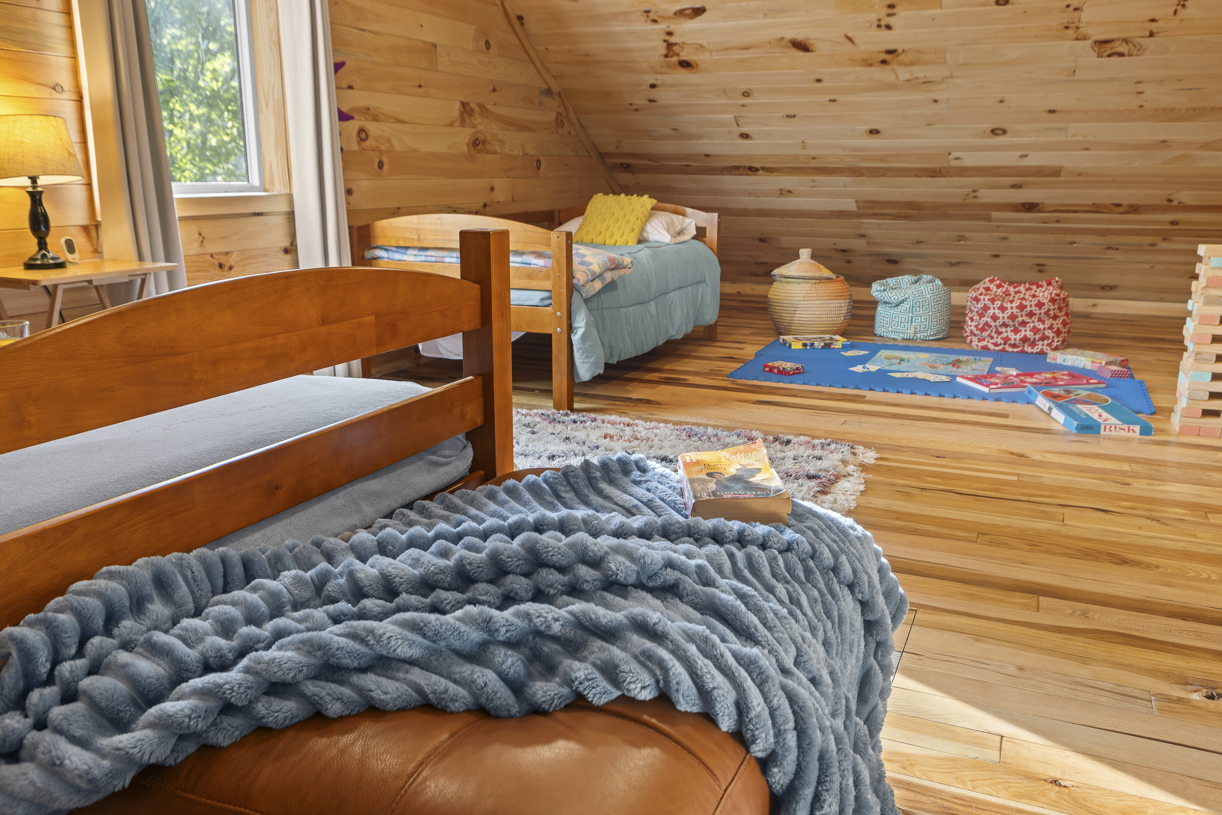 Loft Bedroom 4: Bright, fun retreat with playful decor and game area for family adventures!