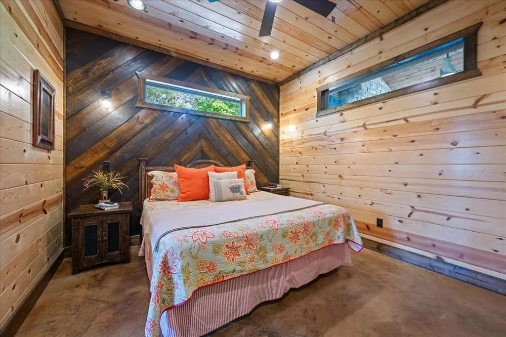 Downstairs bedroom with king bed and TV.