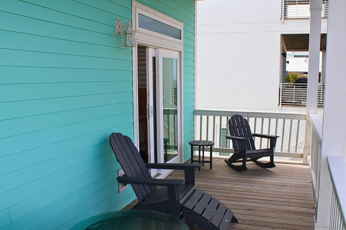 Second Story Deck: Unwind in stylish rocking chairs while soaking in ocean views!