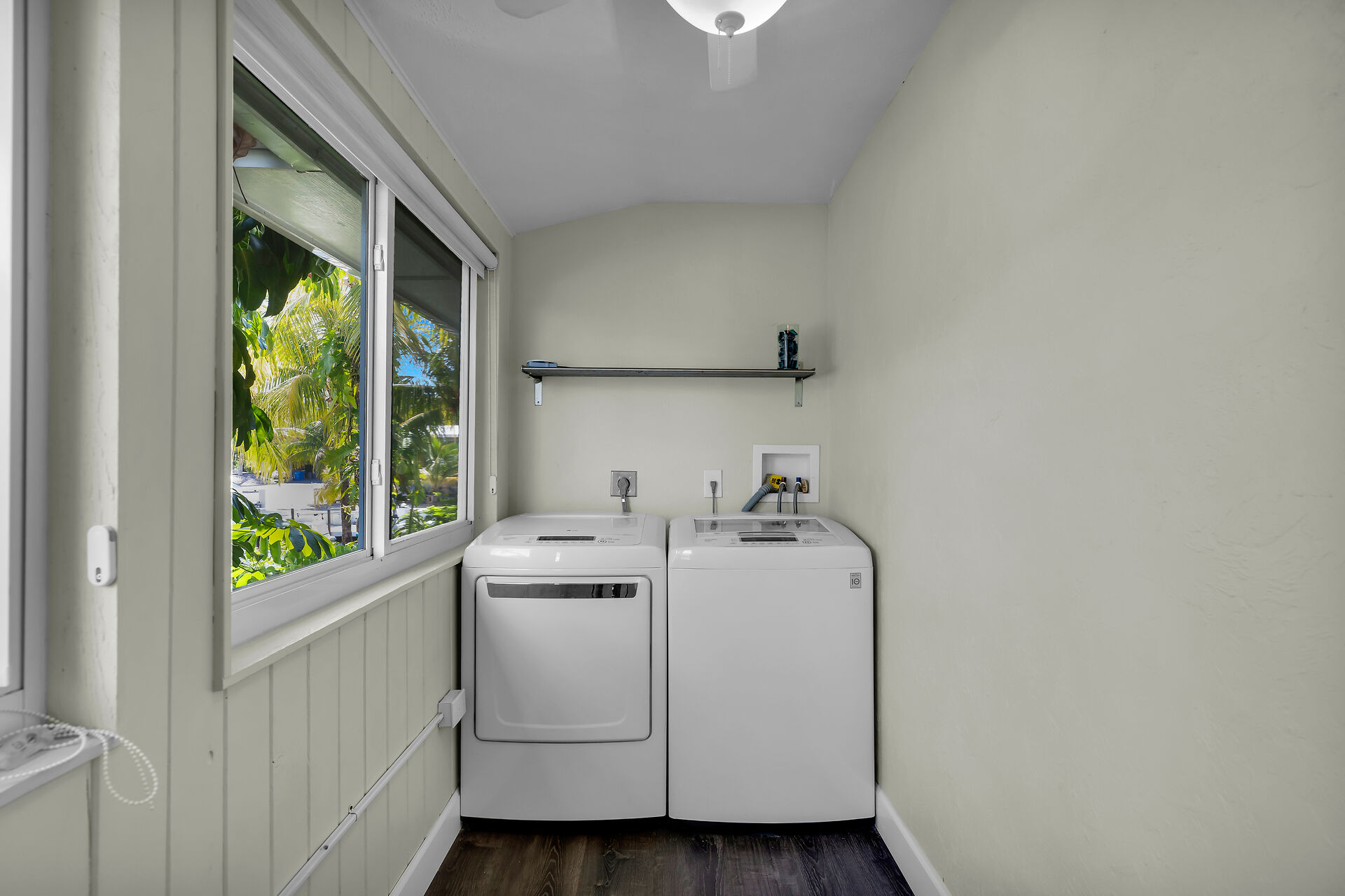 Washer and dryer located off kitchen upstairs