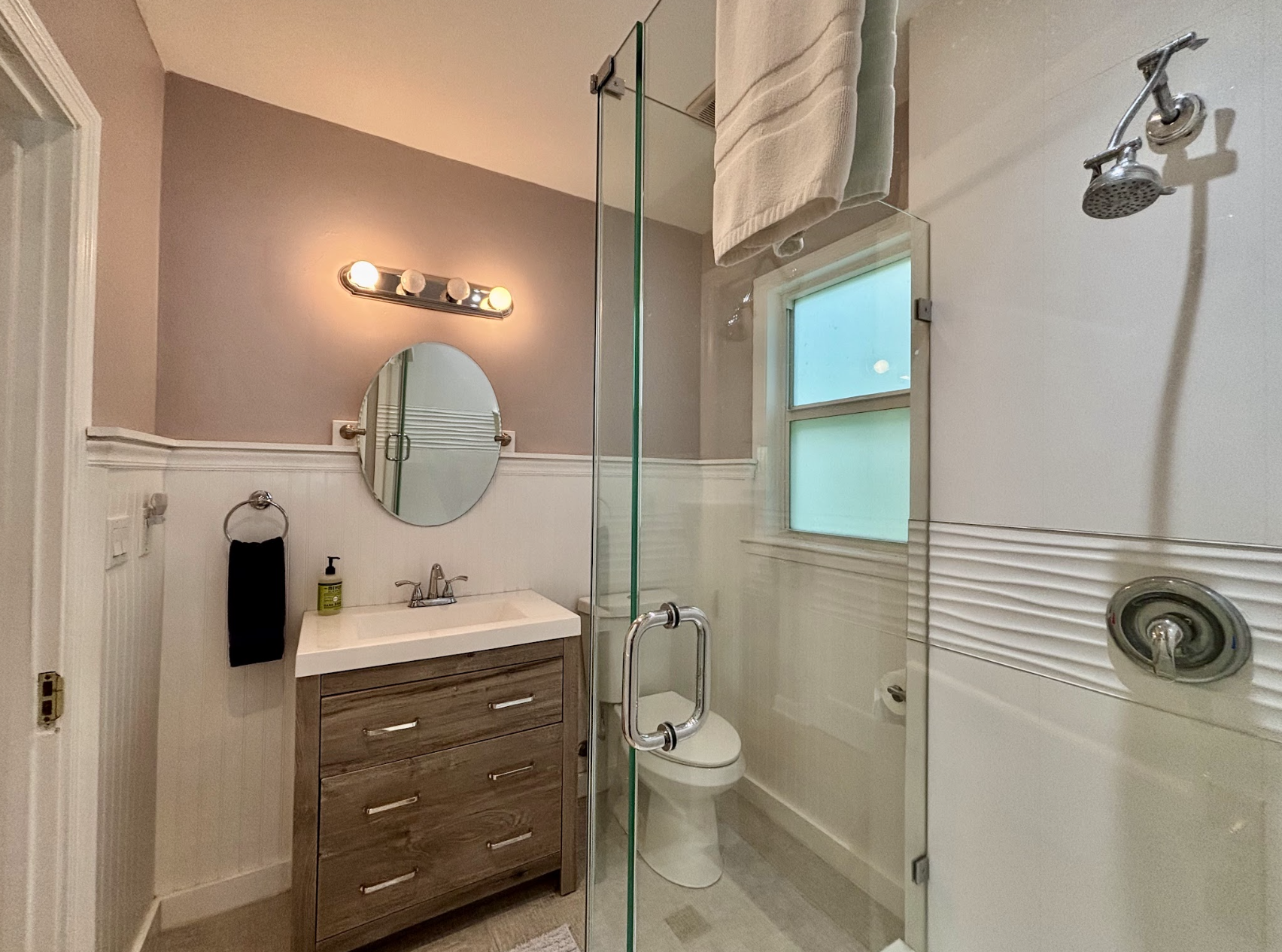 The second bathroom can be accessed from the hallway or the bedroom, and is completely renovated with a new shower.
