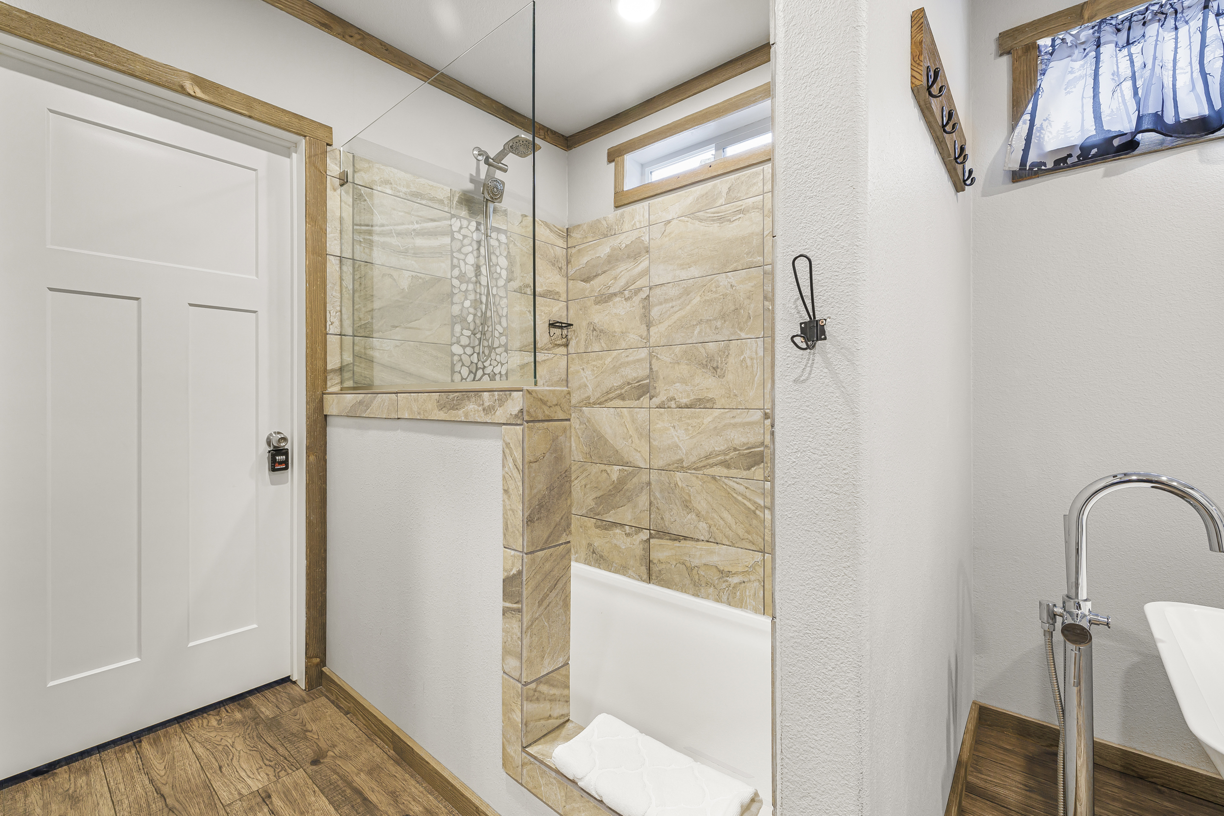 Private primary bathroom with soaking tub and walk in shower