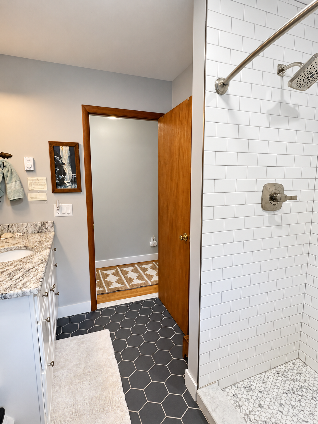 Updated bathroom with tiled shower.