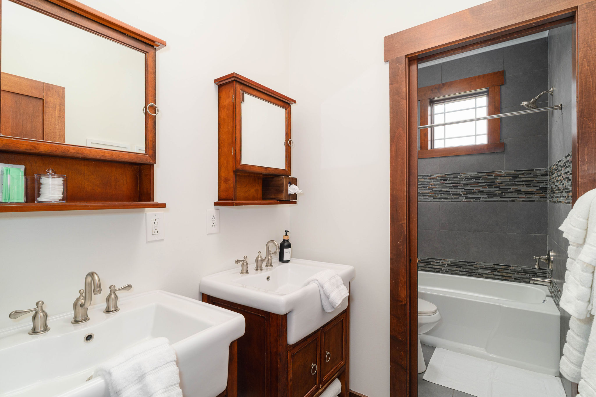 Shared full bathroom with tub/shower combo and clean, updated finishes.