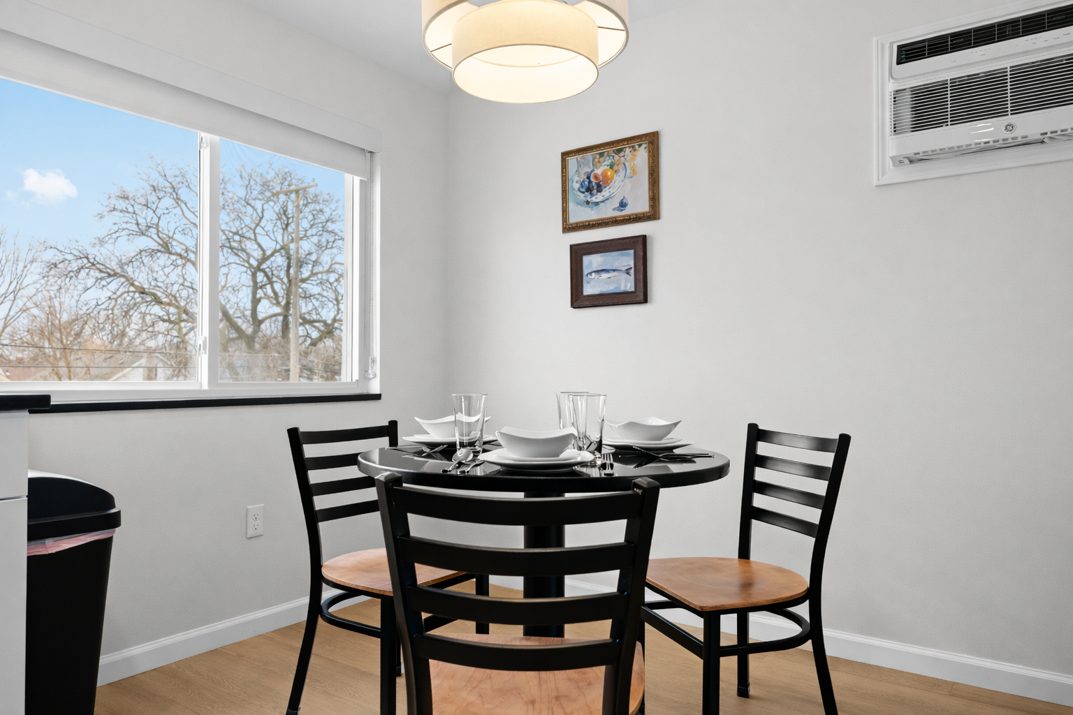 Enjoy meals in this bright dining nook with modern table seating, natural light, and a relaxed setting—perfect for everyday dining or casual gatherings.