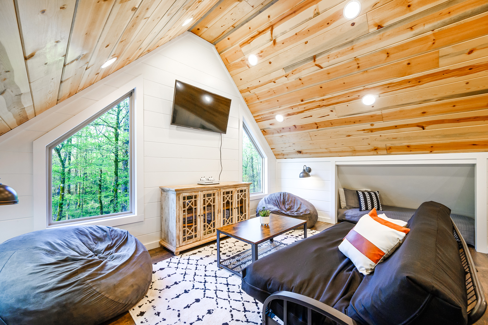 Game loft with high ceilings, a pool table, 4 loft beds that can be rolled out of knooks, smart TV & Xbox so you can stream from your accounts. Beds can be rolled out of knooks. Futon has been replaced with a sectional couch.