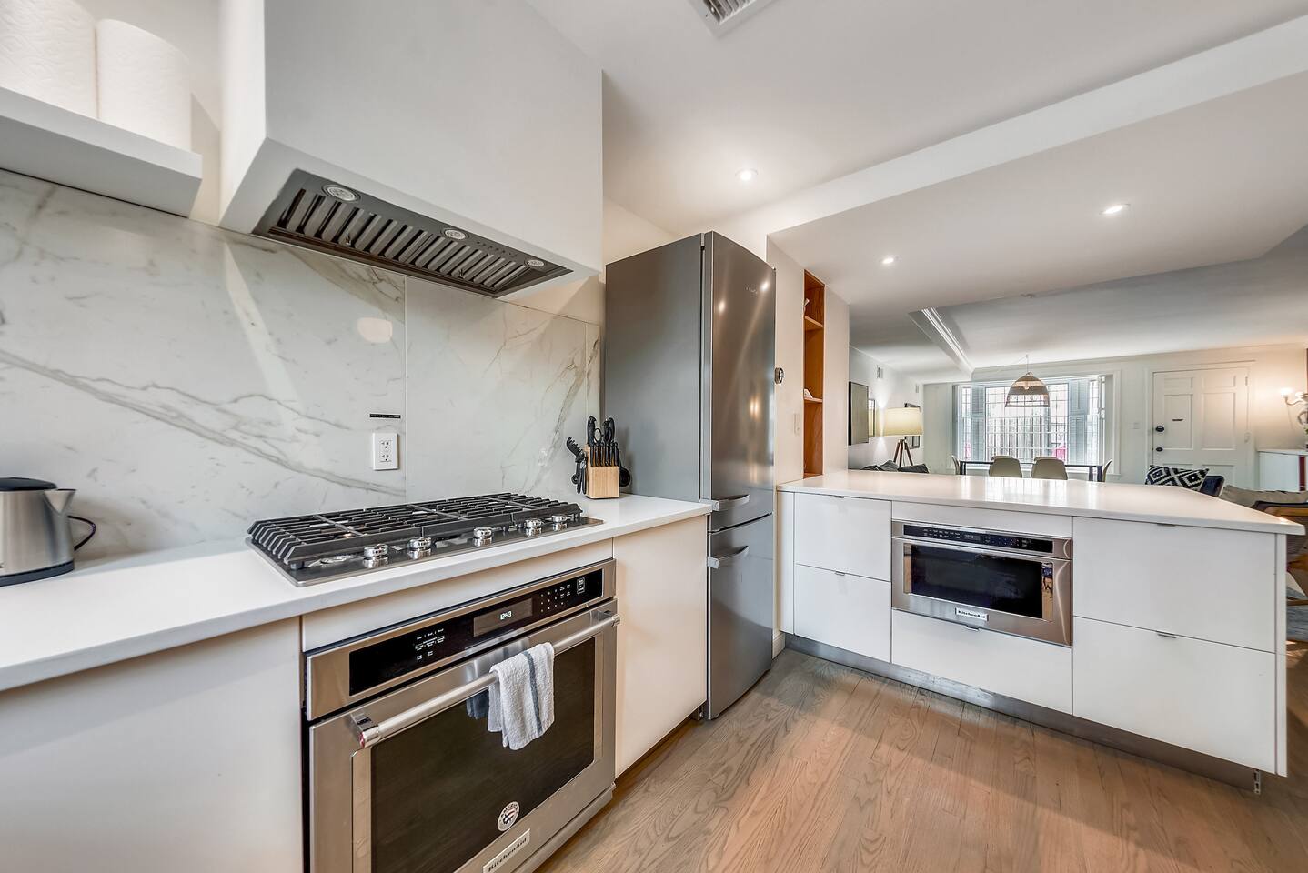 Kitchen: Stainless Steel KitchenAid Appliances, Gas Cooktop & Vent Hood.