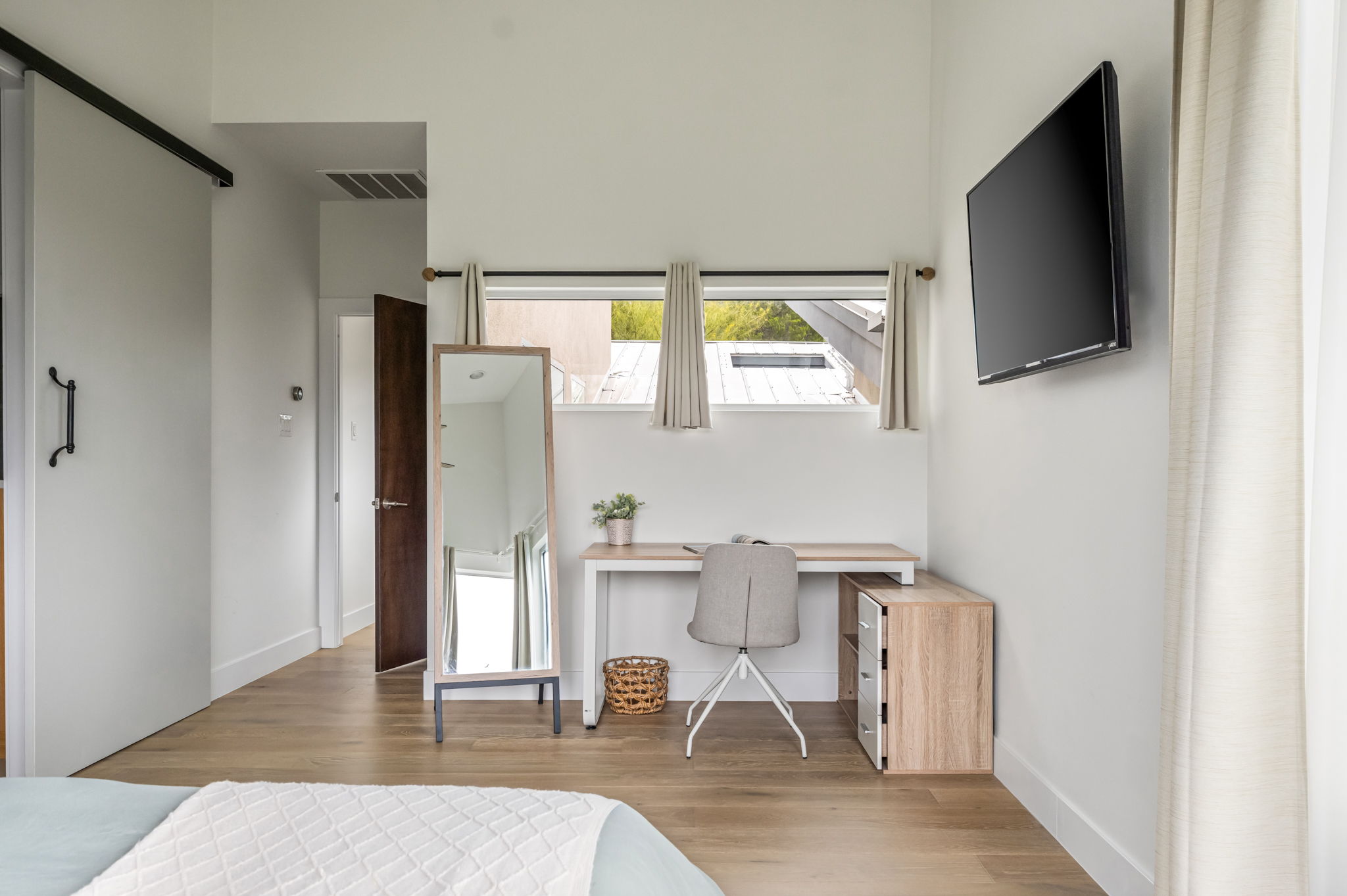 Bright primary suite with desk area, great for longer stays